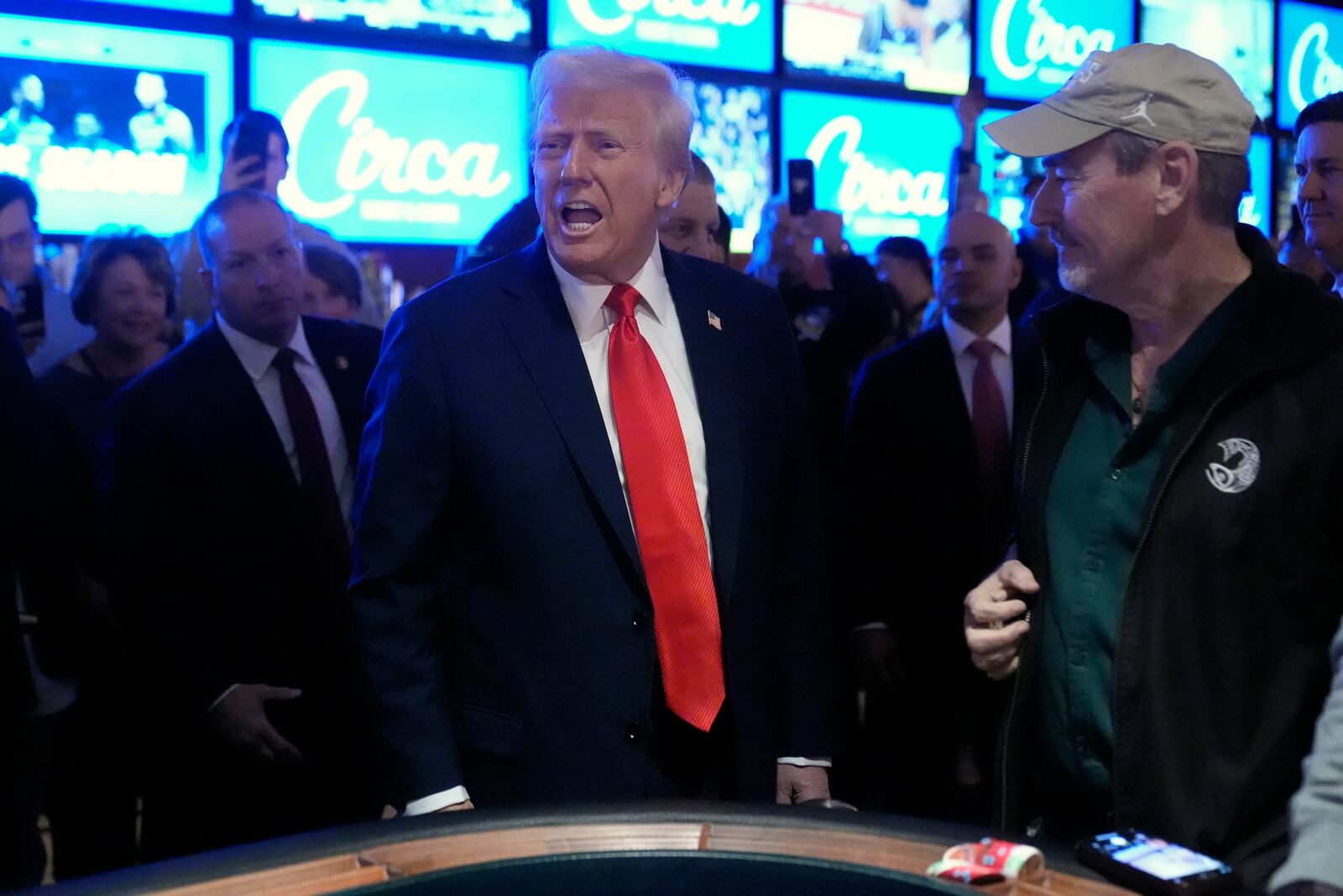 President Donald Trump stands at a craps table after speaking about the economy at the Circa Resort and Casino in Las Vegas, Saturday, Jan. 25, 2025. (AP Photo/Mark Schiefelbein)