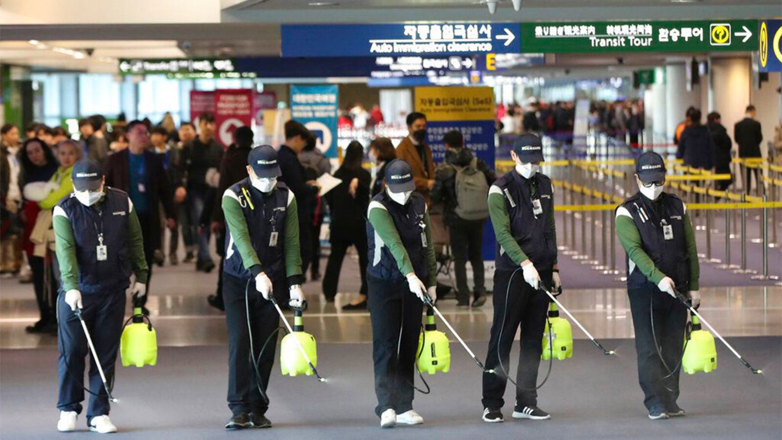 Workers spray antiseptic solution in the arrival lobby amid rising public concerns over the possible spread of a new coronavirus at Incheon International Airport in Incheon, South Korea, Tuesday, Jan. 21, 2020. Heightened precautions were being taken in China and elsewhere Tuesday as governments strove to control the outbreak of a novel coronavirus that threatens to grow during the Lunar New Year travel rush. 