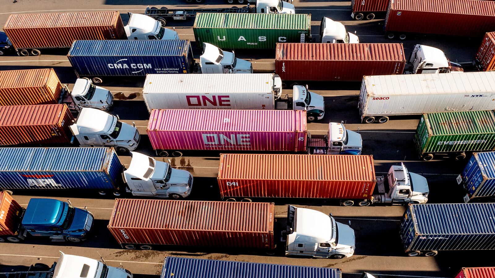 FILE - Trucks line up to enter a Port of Oakland shipping terminal on Nov. 10, 2021, in Oakland, Calif. (AP Photo/Noah Berger, File)