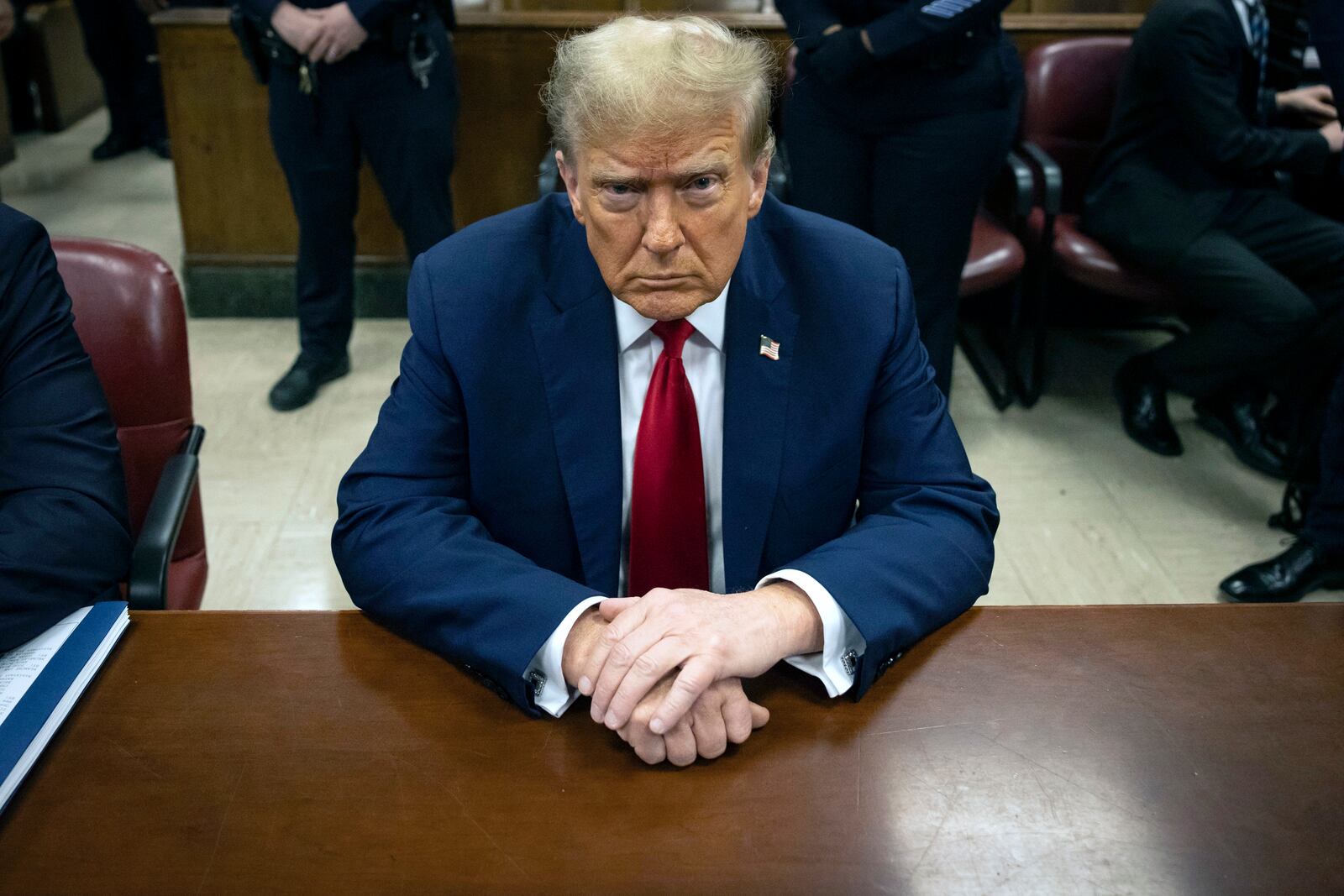 Former President Donald Trump waits for the start of proceedings in Manhattan criminal court, Tuesday, April 23, 2024, in New York. Before testimony resumes Tuesday, the judge will hold a hearing on prosecutors' request to sanction and fine Trump over social media posts they say violate a gag order prohibiting him from attacking key witnesses. (AP Photo/Yuki Iwamura, Pool)