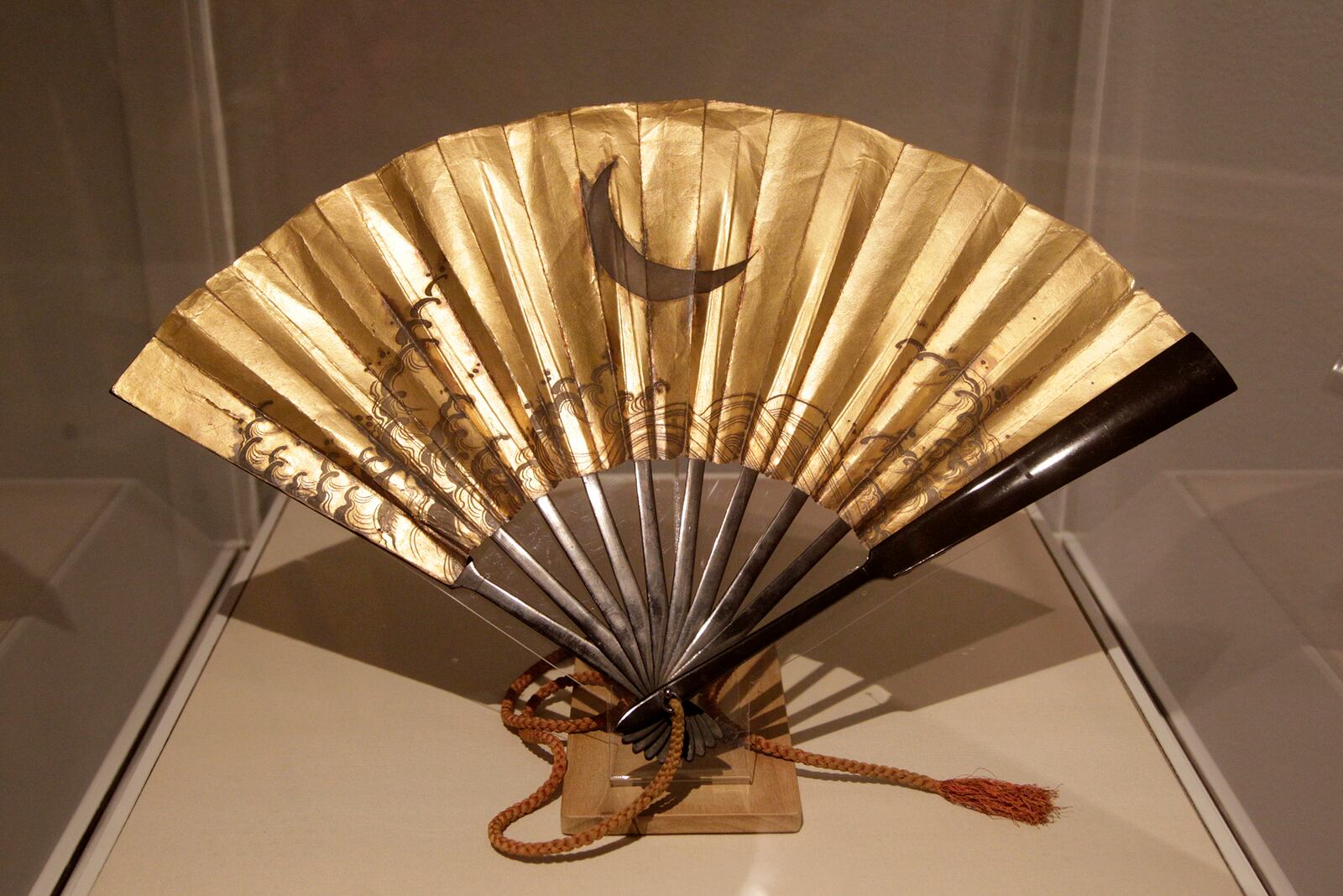 A folding war fan from the 18th century made of wood, lacquer, gold, silver and paper on display in âSamurai, Ghosts and Lovers: Yoshitoshi's Complete 100 Aspects of the Moon,â at the Dayton Art Institute. TLISA POWELL / STAFF