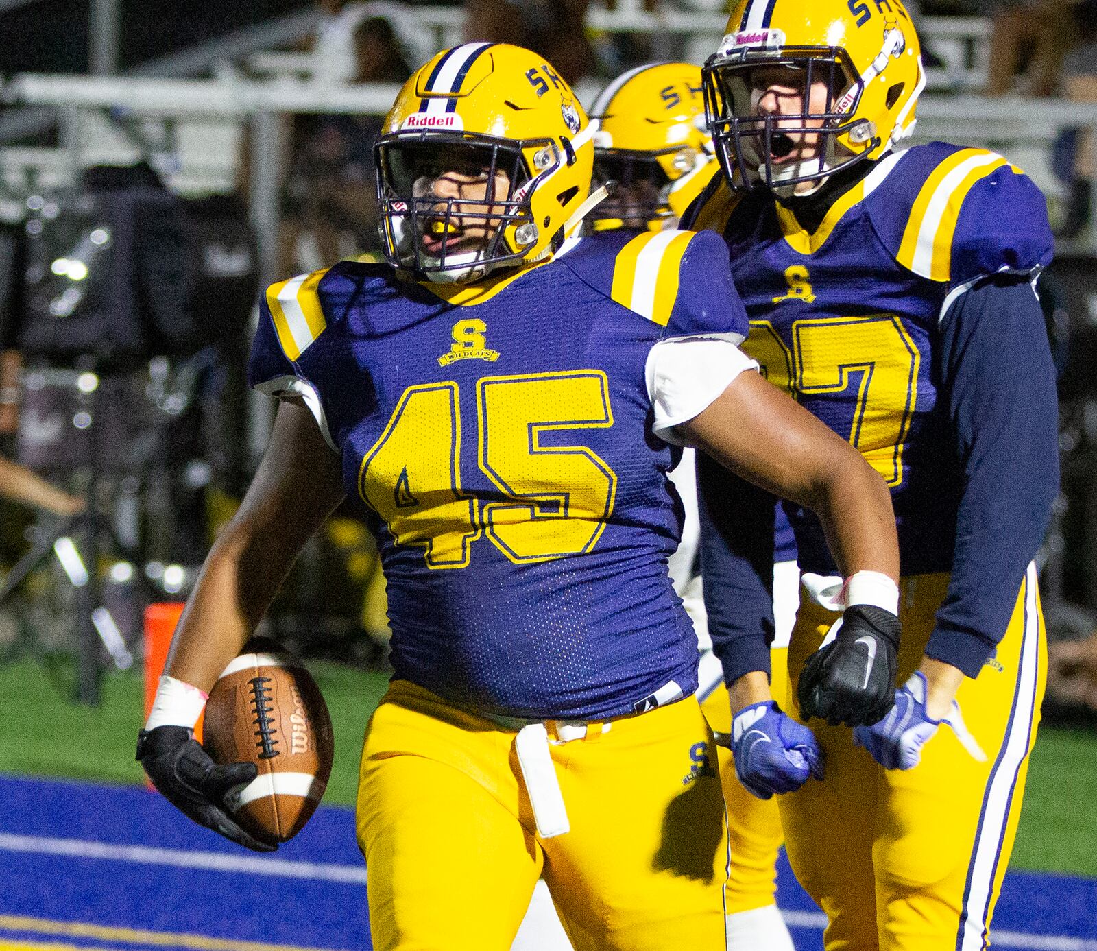 Springfield's Terell Jackson celebrates with teammate Tobias Craycraft after Jackson scored on a fumbled punt return to give Springfield a 27-7 lead in its 27-21 victory over Fairmont on Friday night in Springfield. Jeff Gilbert/CONTRIBUTED