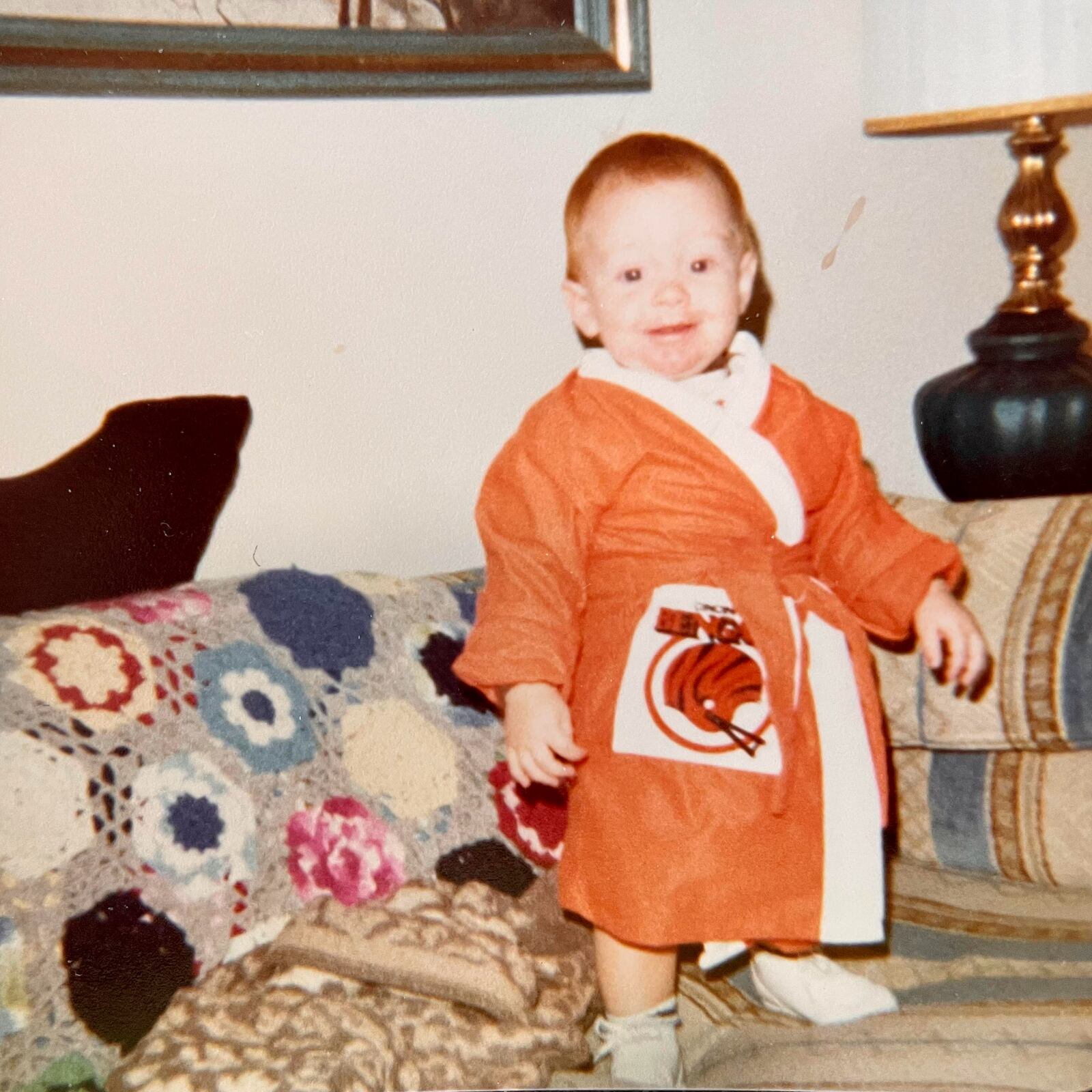 Scott Leo wears a Bengals robe as a kid.