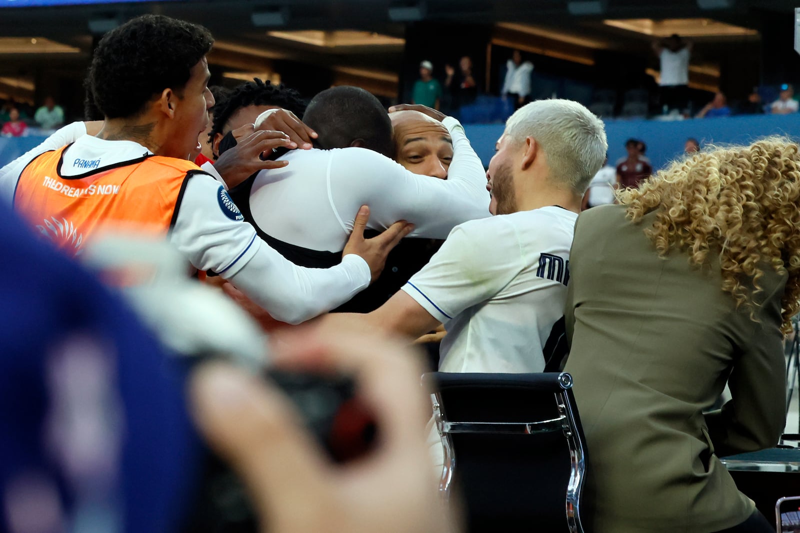 Panama's Cecilio Waterman Ruiz takes former French footballer Thierry Henry in his arm after he jumped on the nearby TV set after scoring against the United States during the second half of a CONCACAF Nations League semifinal soccer match Thursday, March 20, 2025, in Inglewood, Calif. (AP Photo/Etienne Laurent)