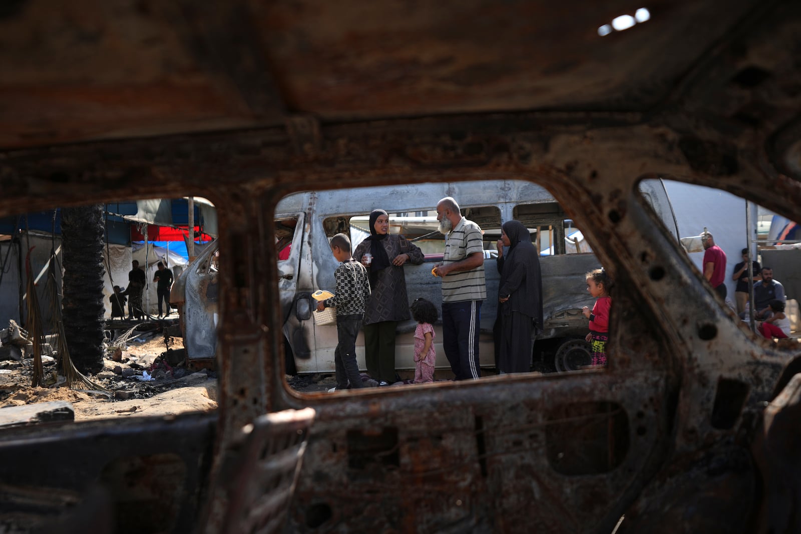 The site of a deadly fire, after an Israeli strike hit a tent area in the courtyard of Al Aqsa Martyrs hospital in Deir al-Balah, Gaza Strip, Wednesday, Oct. 16, 2024. (AP Photo/Abdel Kareem Hana)