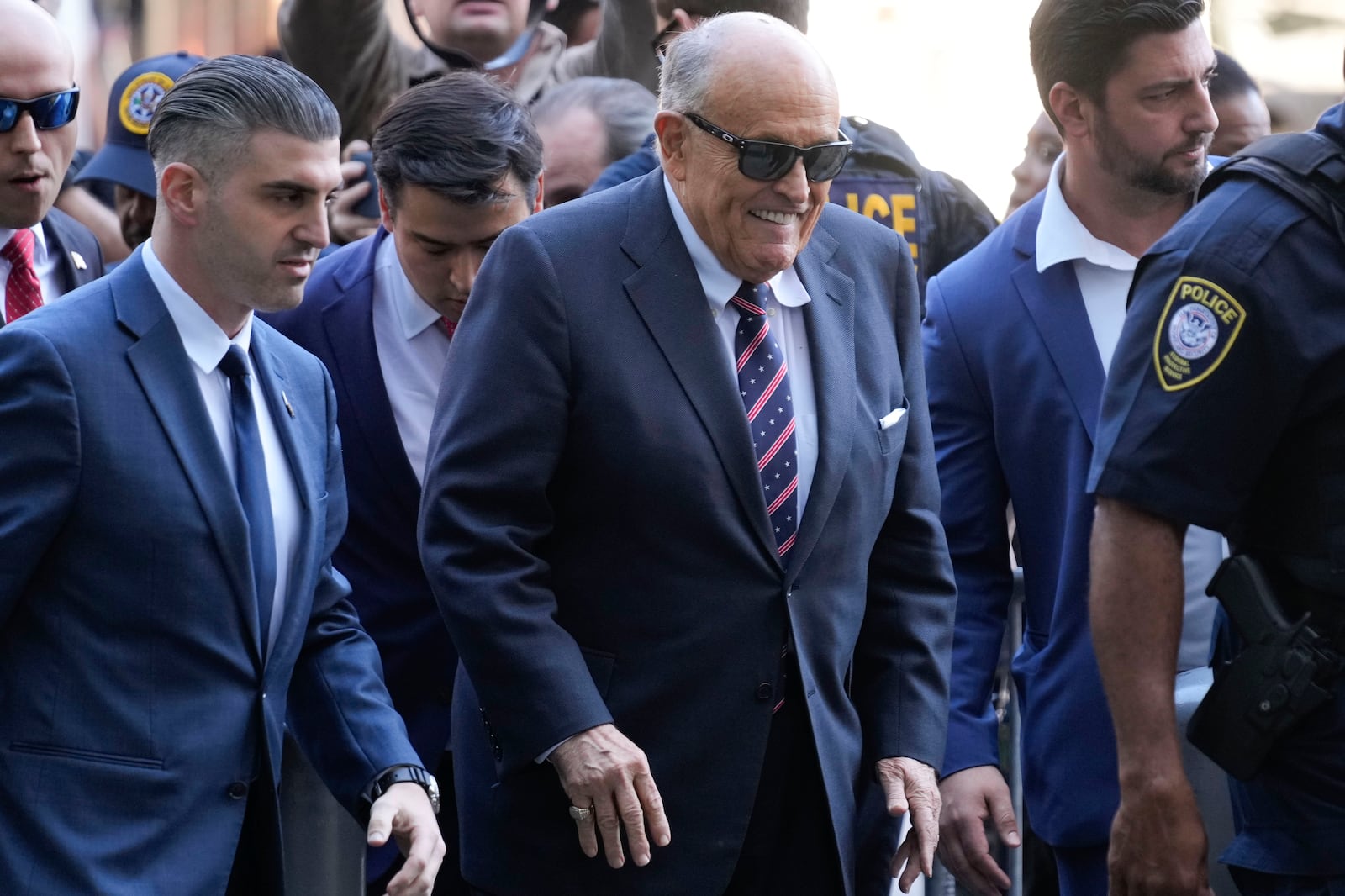 Rudy Giuliani, center, arrives to federal court in New York, Thursday, Nov. 7, 2024. (AP Photo/Seth Wenig)