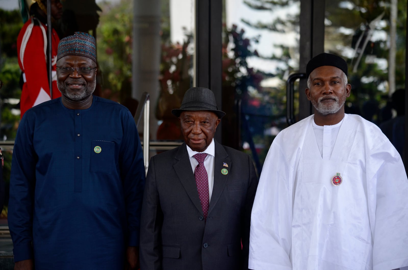 Omar Touray, president of the ECOWAS Commission, left, Liberia's President Joseph Boakai , center and Nigeria Minister of Foreign Affairs, Yusuf Tuggar pose for a photo, prior to the start of the ECOWAS meeting in Abuja, Nigeria, Sunday, Dec 15, 2024. (AP Photo/Olamikan Gbemiga)