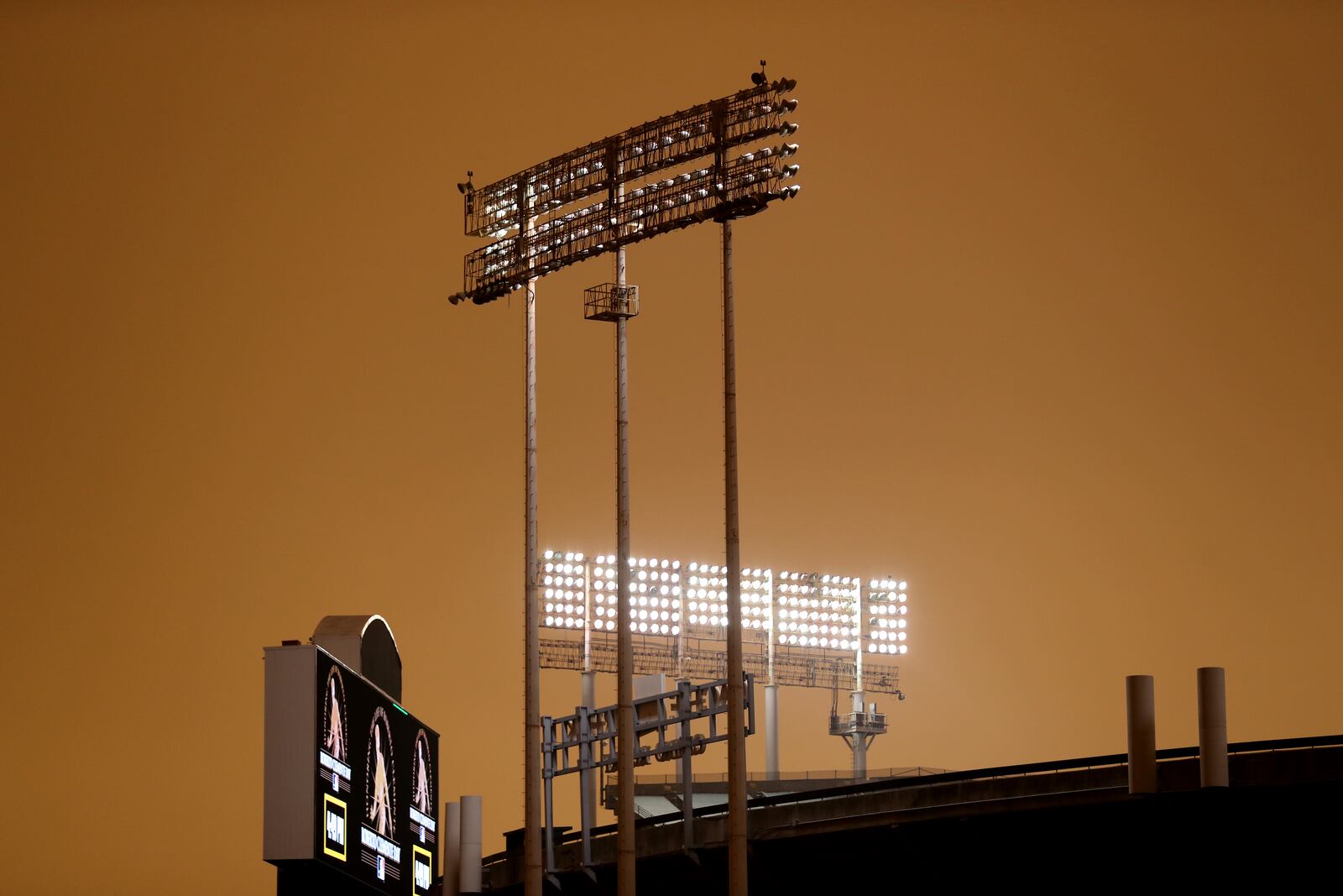 RingCentral Coliseum stands under skies darkened by wildfire smoke before the Oakland Athletics' baseball game against the Houston Astros in Oakland, Calif., Wednesday, Sept. 9, 2020. (AP Photo/Jed Jacobsohn)