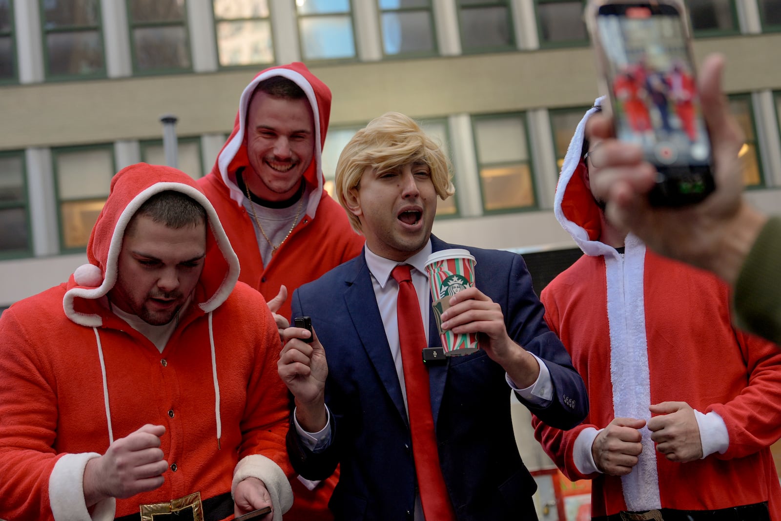 Revellers take part in SantaCon, Saturday, Dec. 14, 2024, in New York. (AP Photo/Julia Demaree Nikhinson)