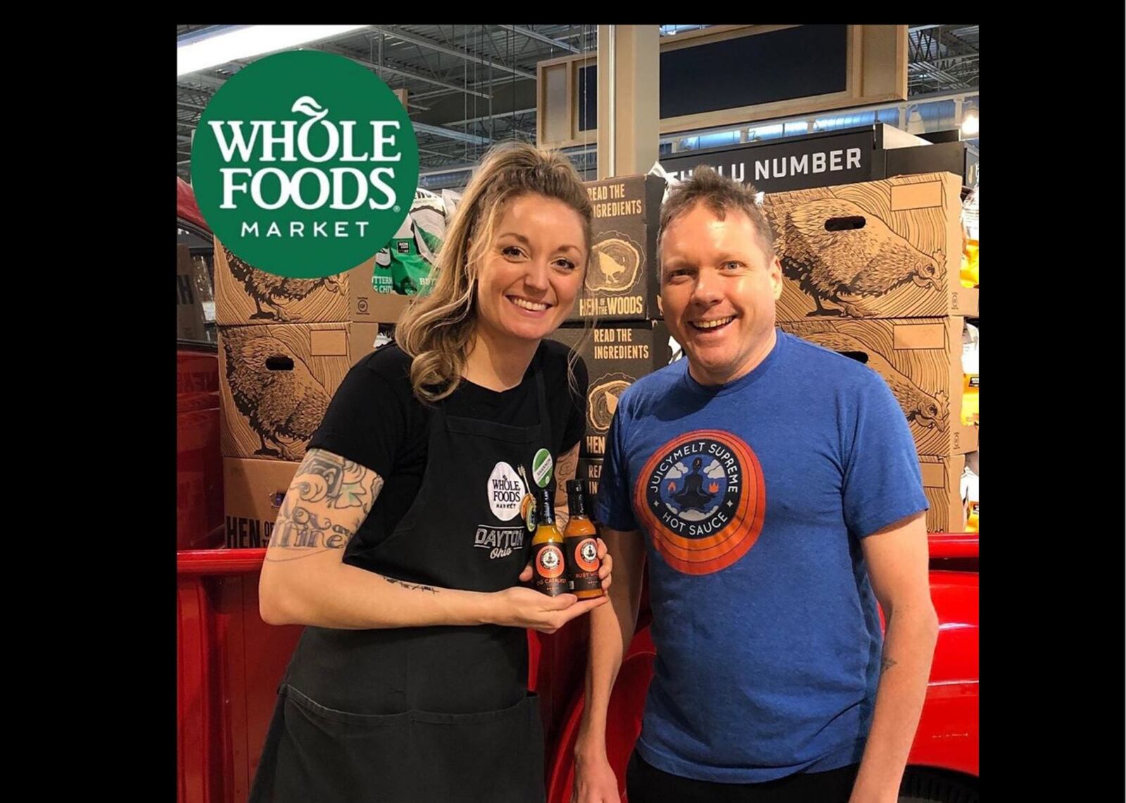 Shannon Szelog, a Whole Foods Market manager, with JuicyMelt Supreme co-owner Jeff McElfresh. The sauce is now sold in the grocery store.