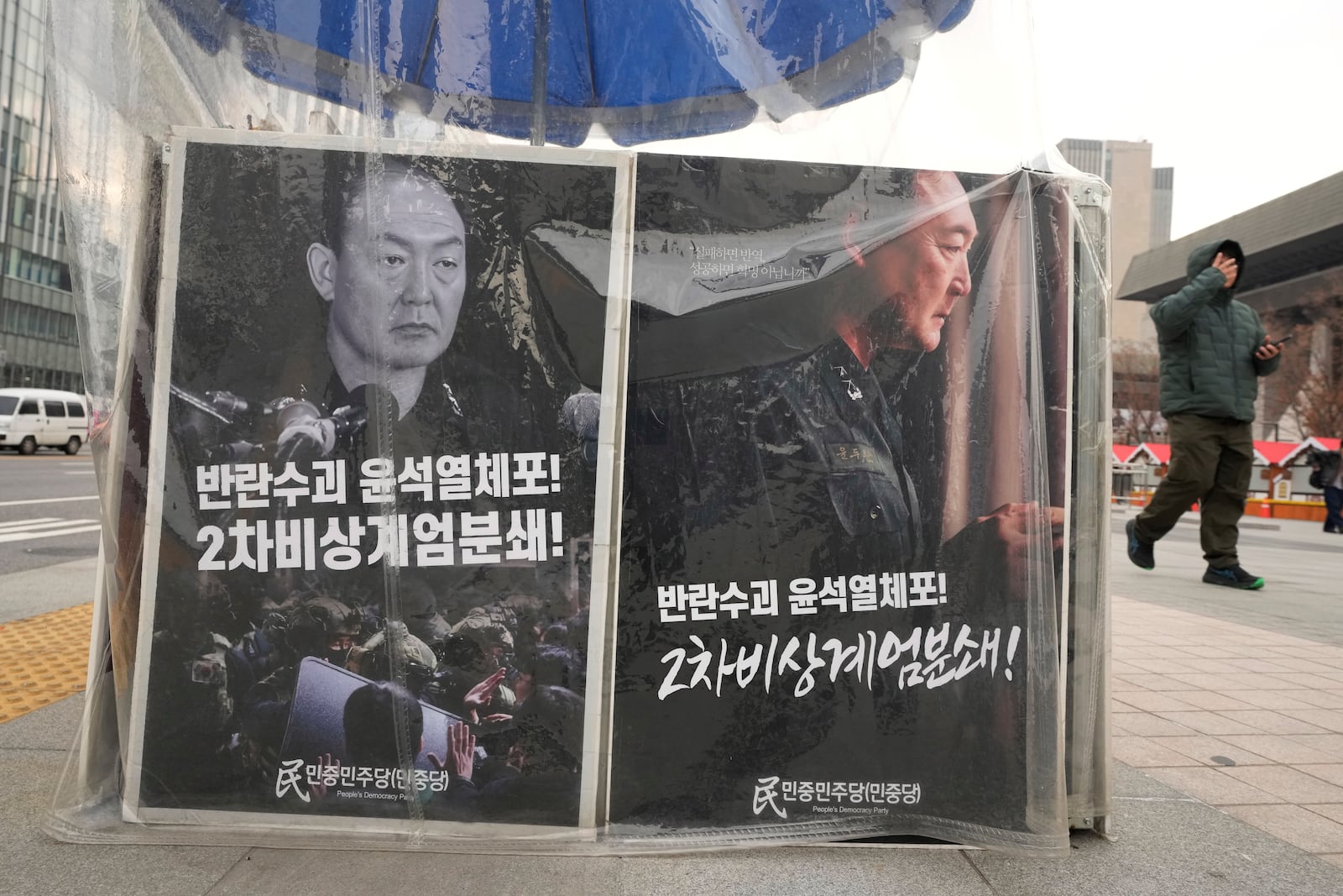 Posters are displayed demanding the arrest of impeached South Korean President Yoon Suk Yeol in Seoul, South Korea, Friday, Dec. 20, 2024. The signs read "Arrest the rebellion leader Yoon Suk Yeol." (AP Photo/Ahn Young-joon)