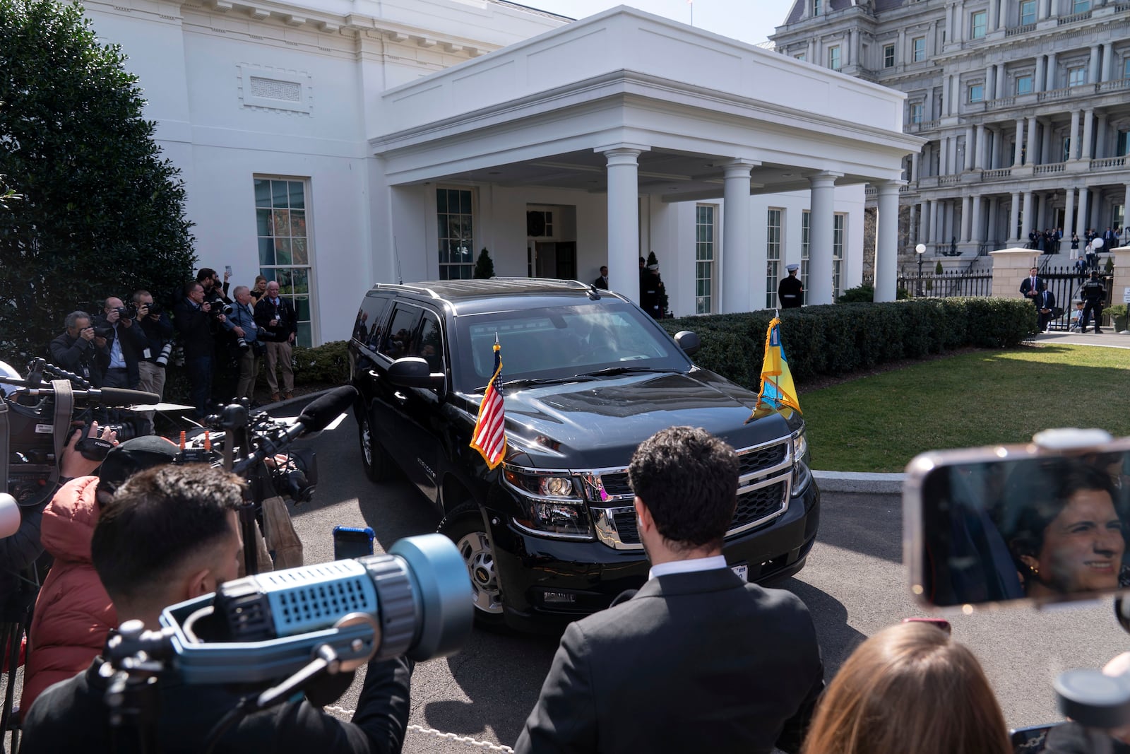 A vehicle with Ukraine's President Volodymyr Zelenskyy on board departs after a meeting with President Donald Trump at the White House in Washington, Friday, Feb. 28, 2025. (AP Photo/Jose Luis Magana)