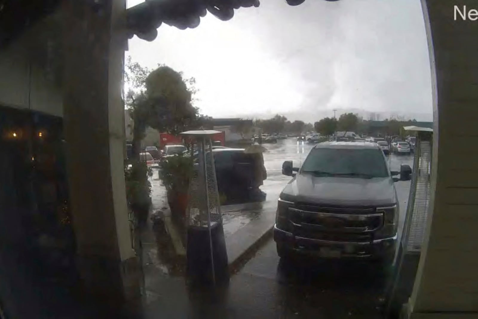 This image made from video provided Bruno's Bar and Grill shows a tornado descending on Scotts Valley, Calif., Saturday, Dec. 14, 2024. (Bruno's Bar and Grill via AP)