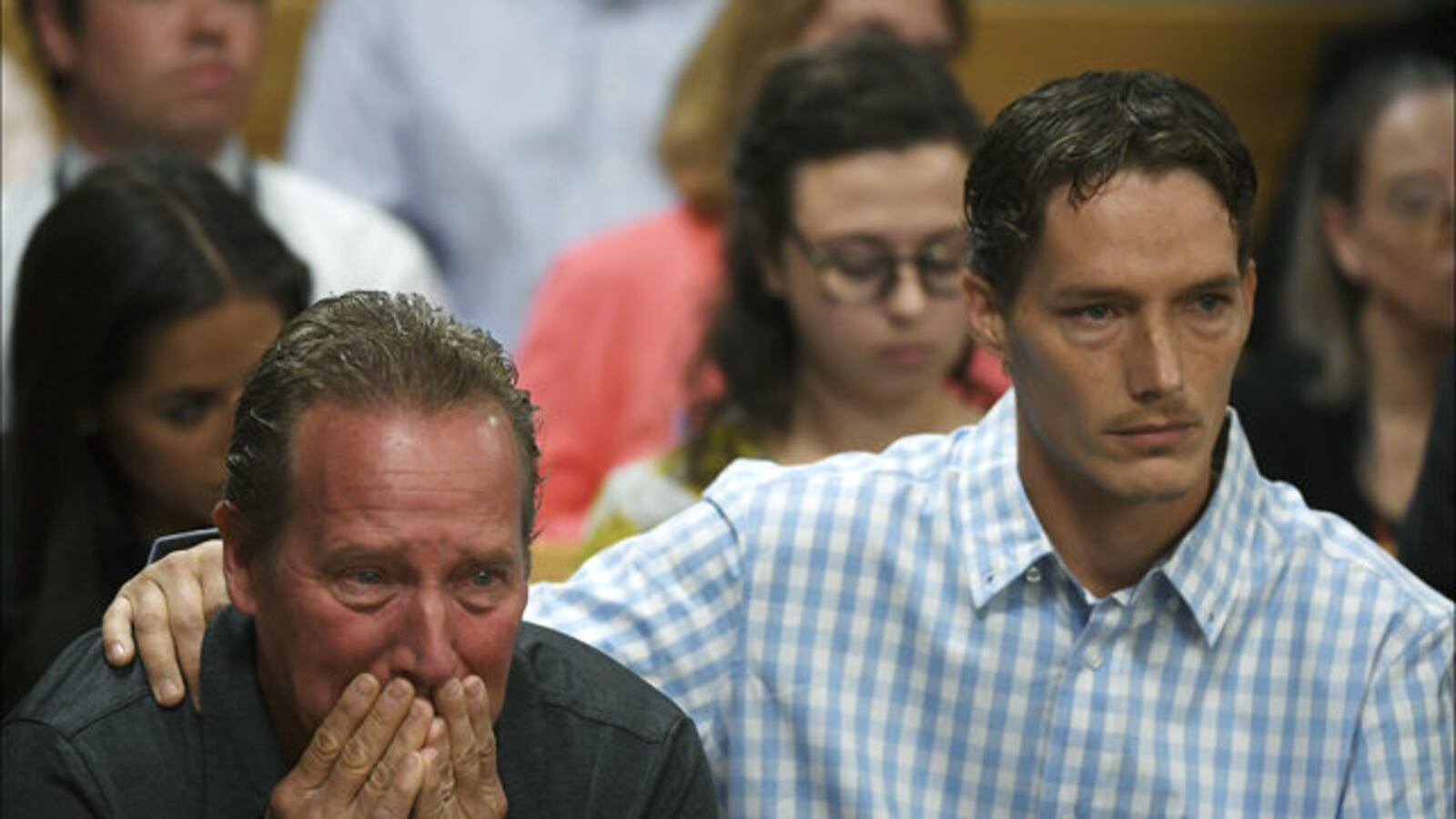 Shanann Watts' father, Frank Rzucek, weeps in a Colorado courtroom Aug. 21, 2019, as Shanann's brother, Frankie Rzucek, comforts him. Chris Watts is serving multiple life sentences in the deaths of Shanann, his wife, and their two daughters.