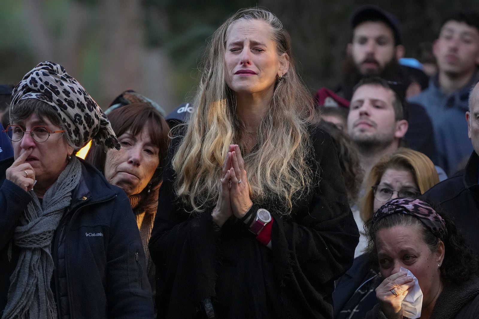 Relatives and friends of 1st Sgt. Hillel Diener, who was killed in combat in the Gaza Strip, mourn during his funeral at the Mount Herzl military cemetery in Jerusalem, Israel, Tuesday, Dec. 24, 2024. (AP Photo/Ohad Zwigenberg)