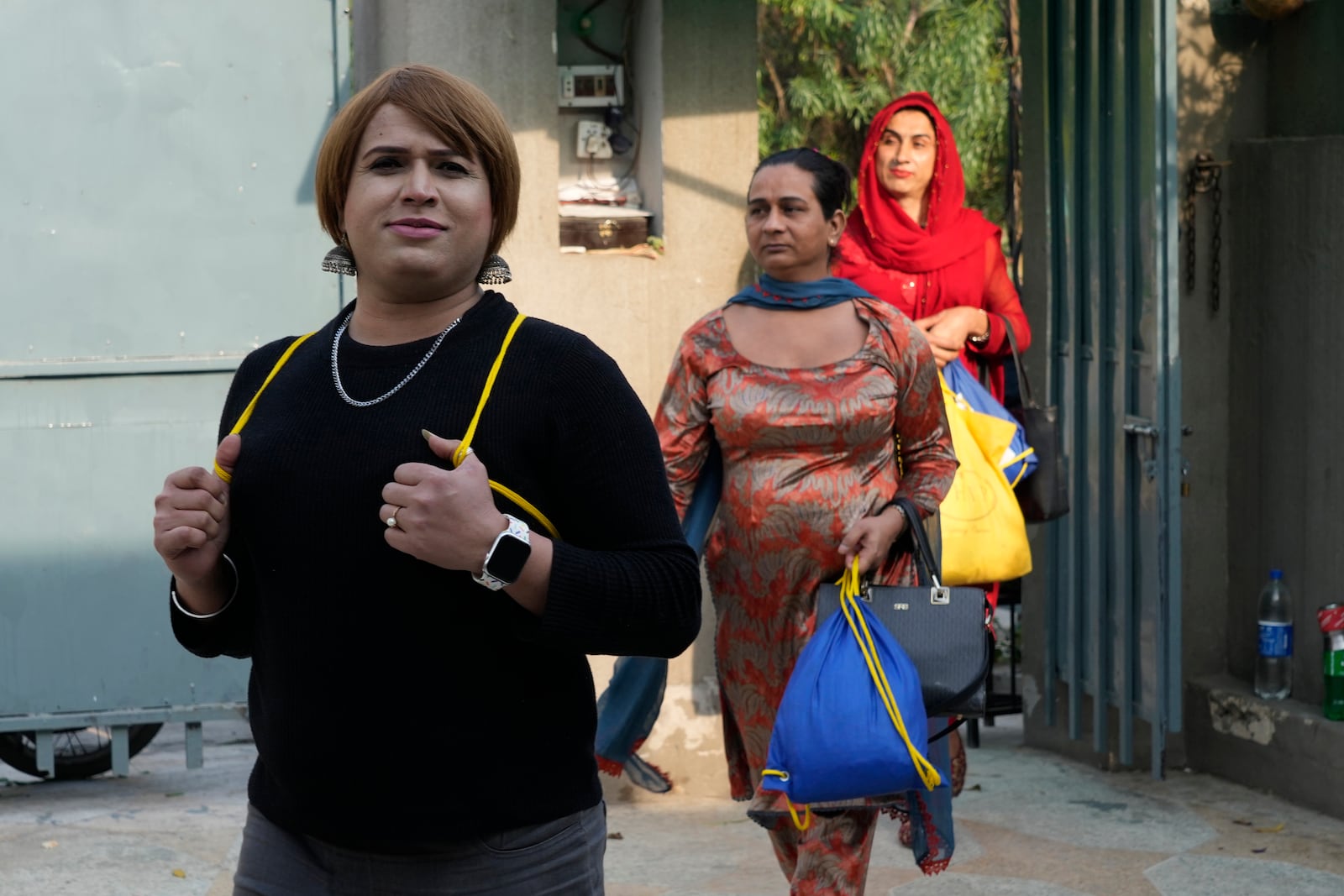 Transgender persons arrive to attend their cooking class at the Culinary & Hotel Institute of Pakistan, in Lahore, Pakistan, Tuesday, Feb. 25, 2025. (AP Photo/K.M Chaudary)