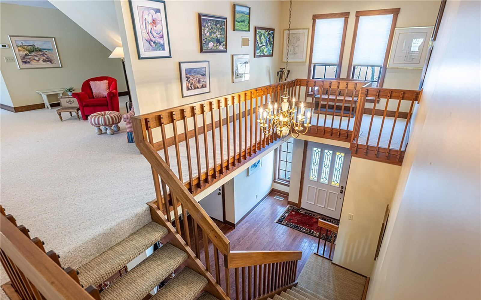 The open staircase leads to an oversized loft area with built ins and two additional full bedrooms.