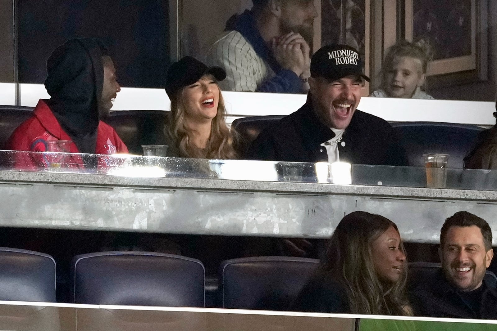 Travis Kelce, right, and Taylor Swift attend Game 1 of the baseball AL Championship Series between the Cleveland Guardians and New York Yankees Monday, Oct. 14, 2024, in New York. (AP Photo/Seth Wenig)