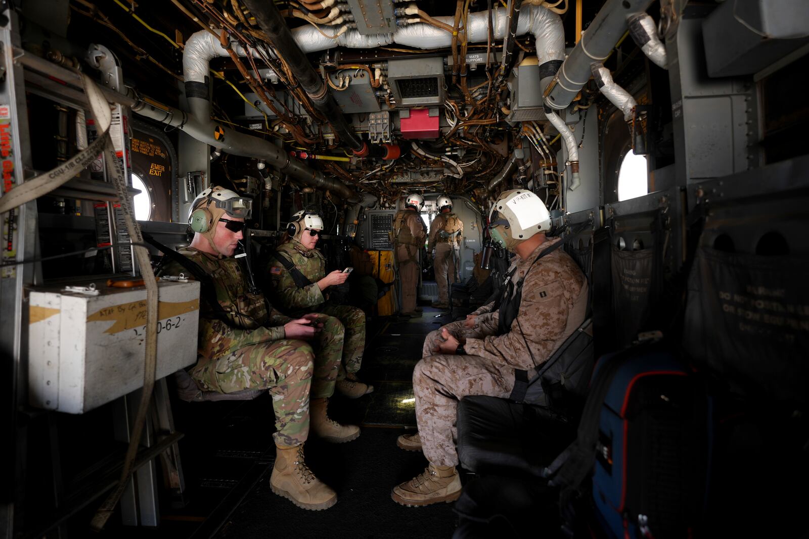 Military personnel board a U.S. Marine Osprey at the Naval Outlying Landing Field Friday, Jan. 31, 2025, in Imperial Beach, Calif. (AP Photo/Jae C. Hong)