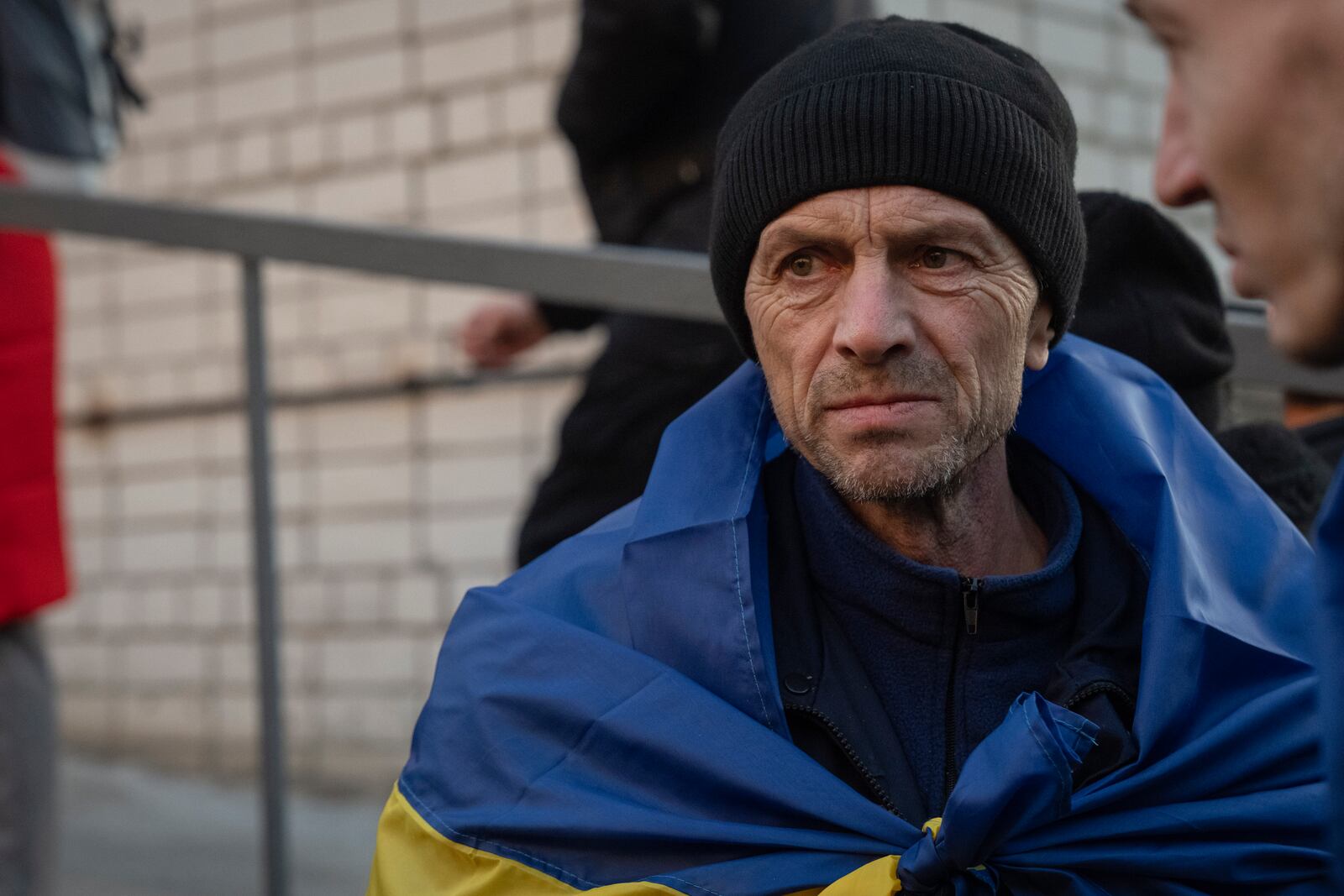 A Ukrainian serviceman reacts after returning from captivity during a POWs exchange between Russia and Ukraine, in Chernyhiv region, Ukraine, Wednesday, March 19, 2025. (AP Photo/Efrem Lukatsky)