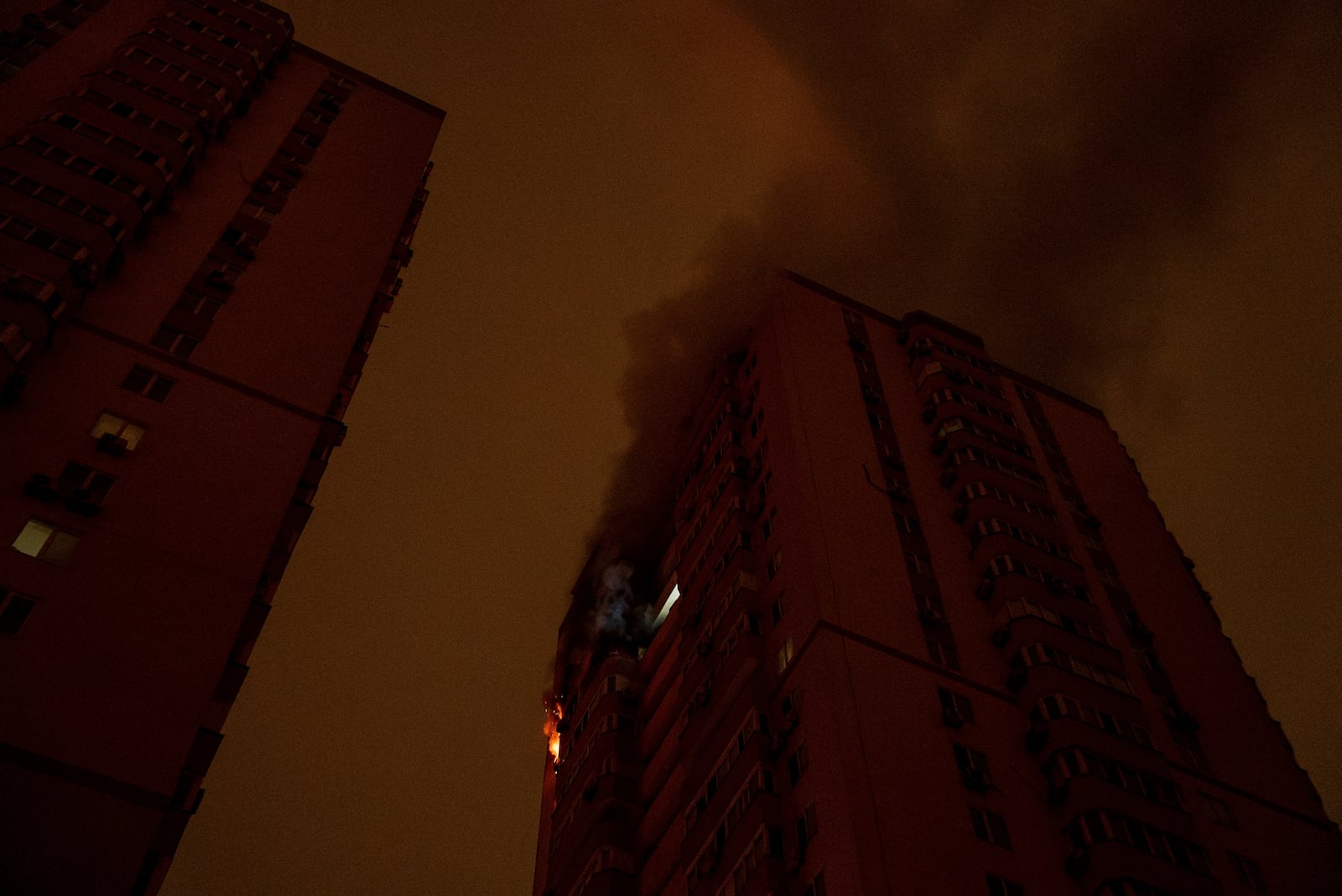 A residential building burns after an attack of Russian drones killed a teenager in Kyiv, Ukraine, Friday, Oct. 25, 2024. (AP Photo/Alex Babenko)