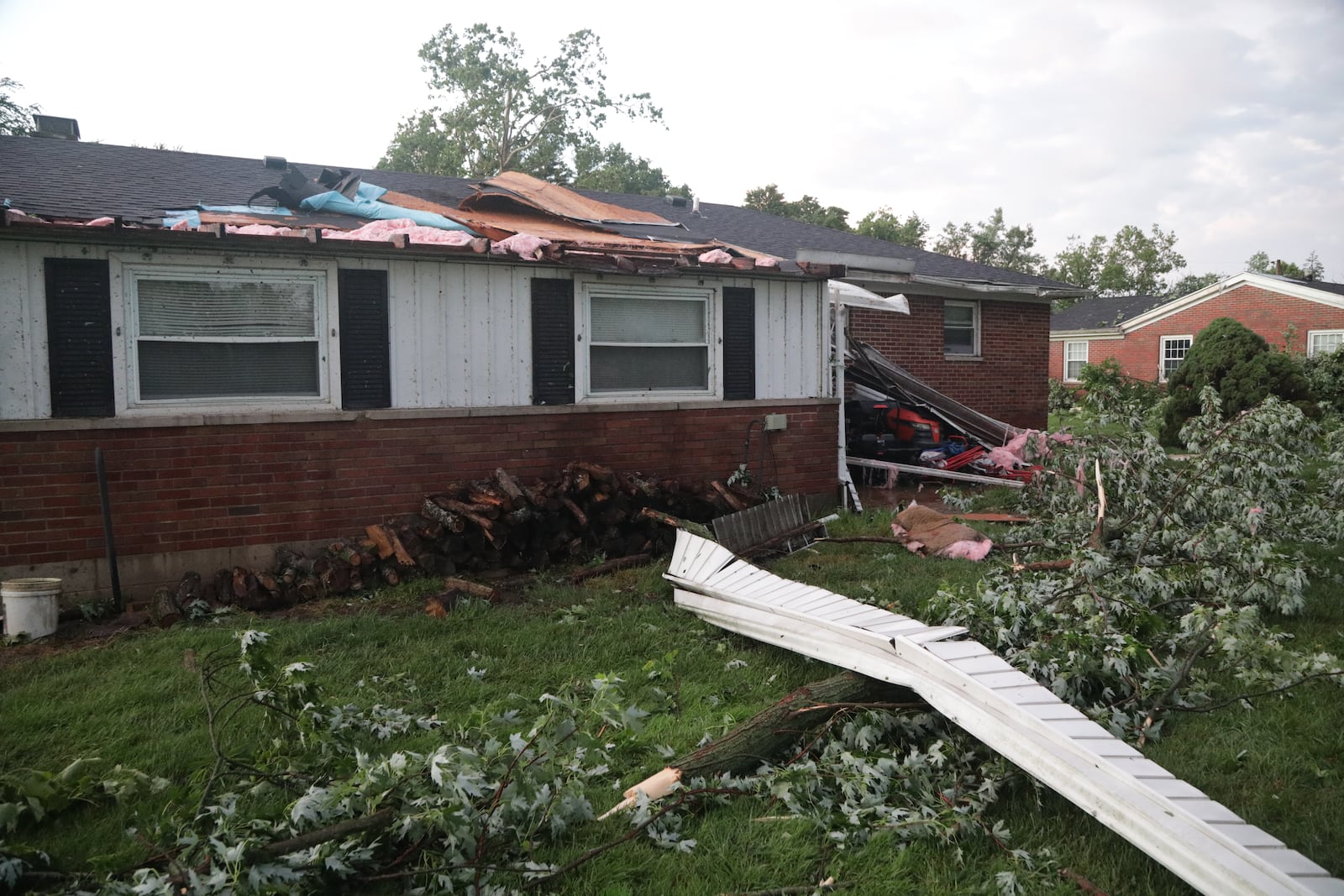 A house along Delrey Road in German Twp. had part of the roof ripped off during the storm on Wednesday evening, June 8, 2022. An EF1 tornado touched down north of Springfield. BILL LACKEY/STAFF