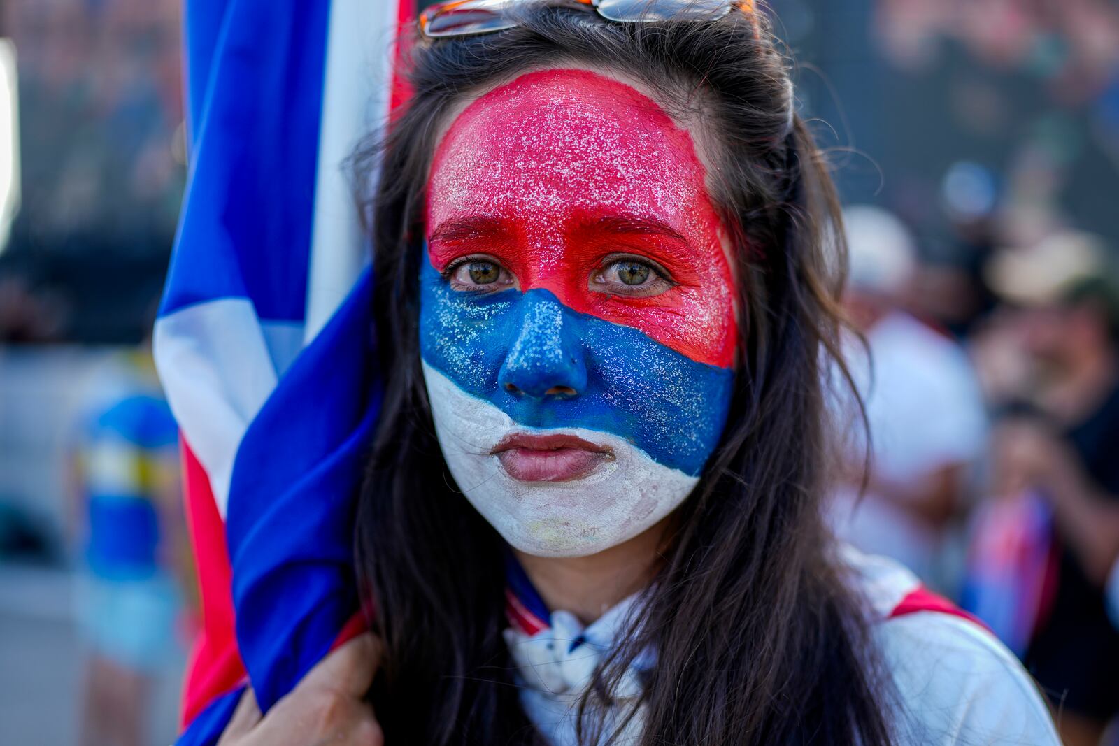 Claudia Noble stands outside the Broad Front's (Frente Amplio) election night headquarters after polls closed for the presidential run-off election in Montevideo, Uruguay, Sunday, Nov. 24, 2024. (AP Photo/Natacha Pisarenko)