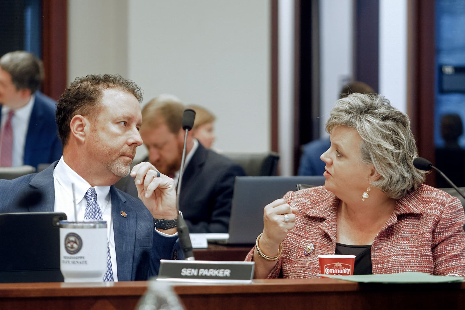 Sen. Nicole Akins Boyd, R-Oxford, right, talks with David Parker, R-Olive Branch, during a Mississippi Joint Legislative Budget Committee meeting at the Woolfolk state office building Sept. 26, 2024, in Jackson, Miss. (AP Photo/Justin Hardiman)