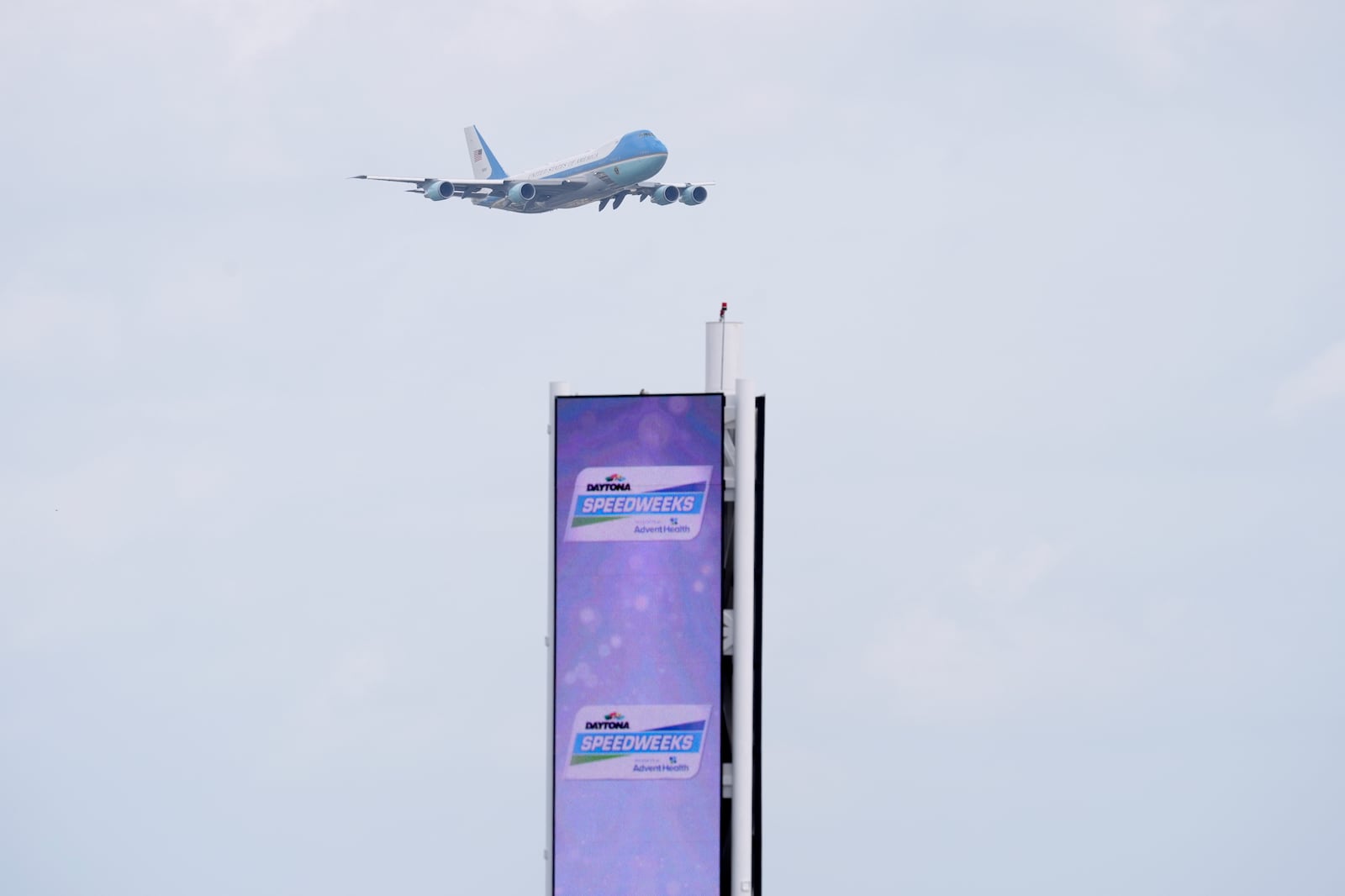 Air Force One with President Donald Trump on board flies over the scoring tower at the NASCAR Daytona 500 auto race as it flies near Daytona International Speedway, Sunday, Feb. 16, 2025, in Daytona Beach, Fla. (AP Photo/Chris O'Meara)