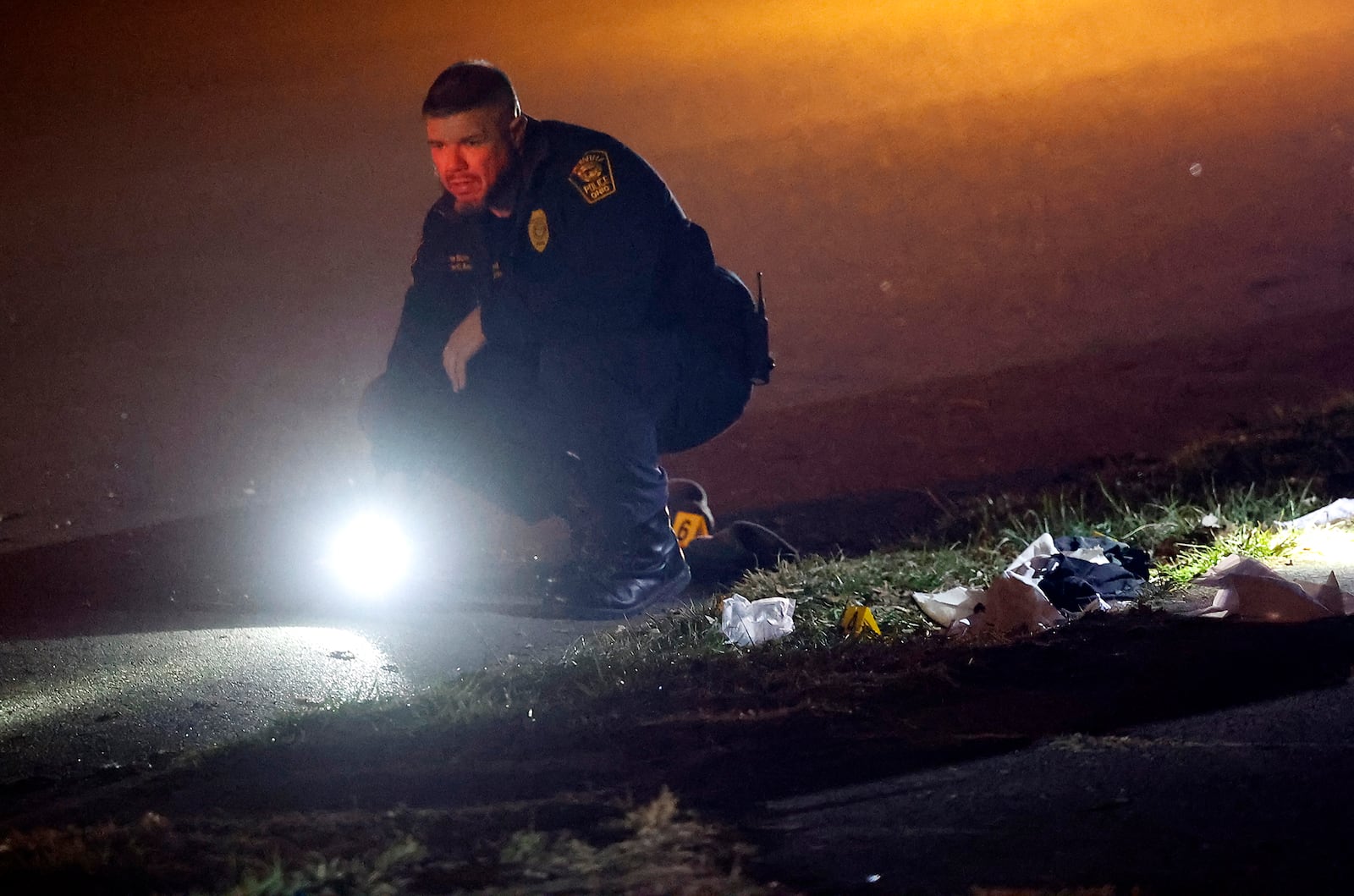 The Springfield Police Division investigates the scene of a shooting along the 600 block of Euclid Avenue Thursday evening, Dec. 21, 2023. According to police they arrived to find a male laying beside the road with a gunshot wound to the head. The victim was transported to Springfield Regional Medical Center and flown by CareFlight to Miami Valley Hospital. BILL LACKEY/STAFF