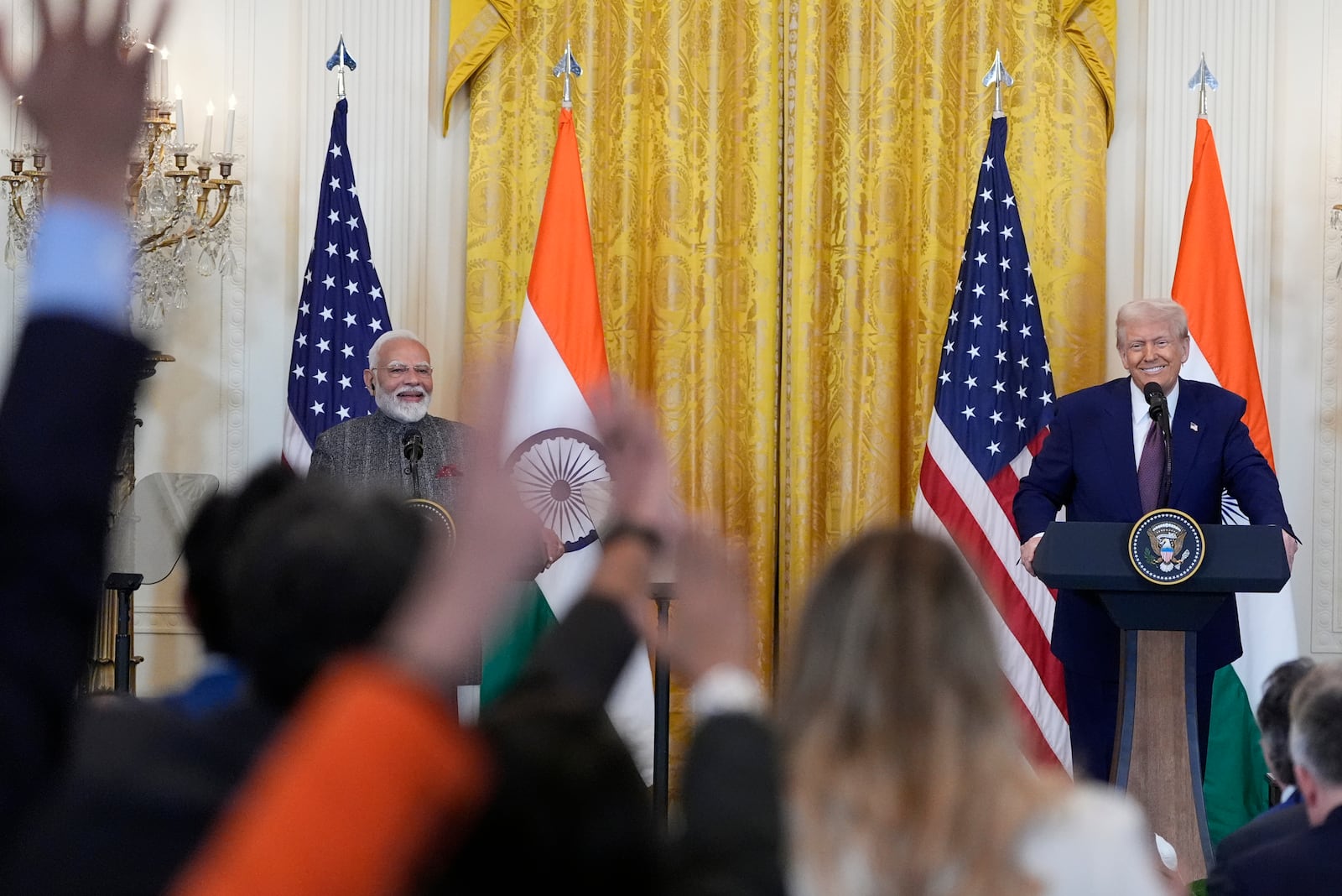 Reporters raise their hands to ask questions during a news conference with President Donald Trump and India's Prime Minister Narendra Modi in the East Room of the White House, Thursday, Feb. 13, 2025, in Washington. (Photo/Alex Brandon)