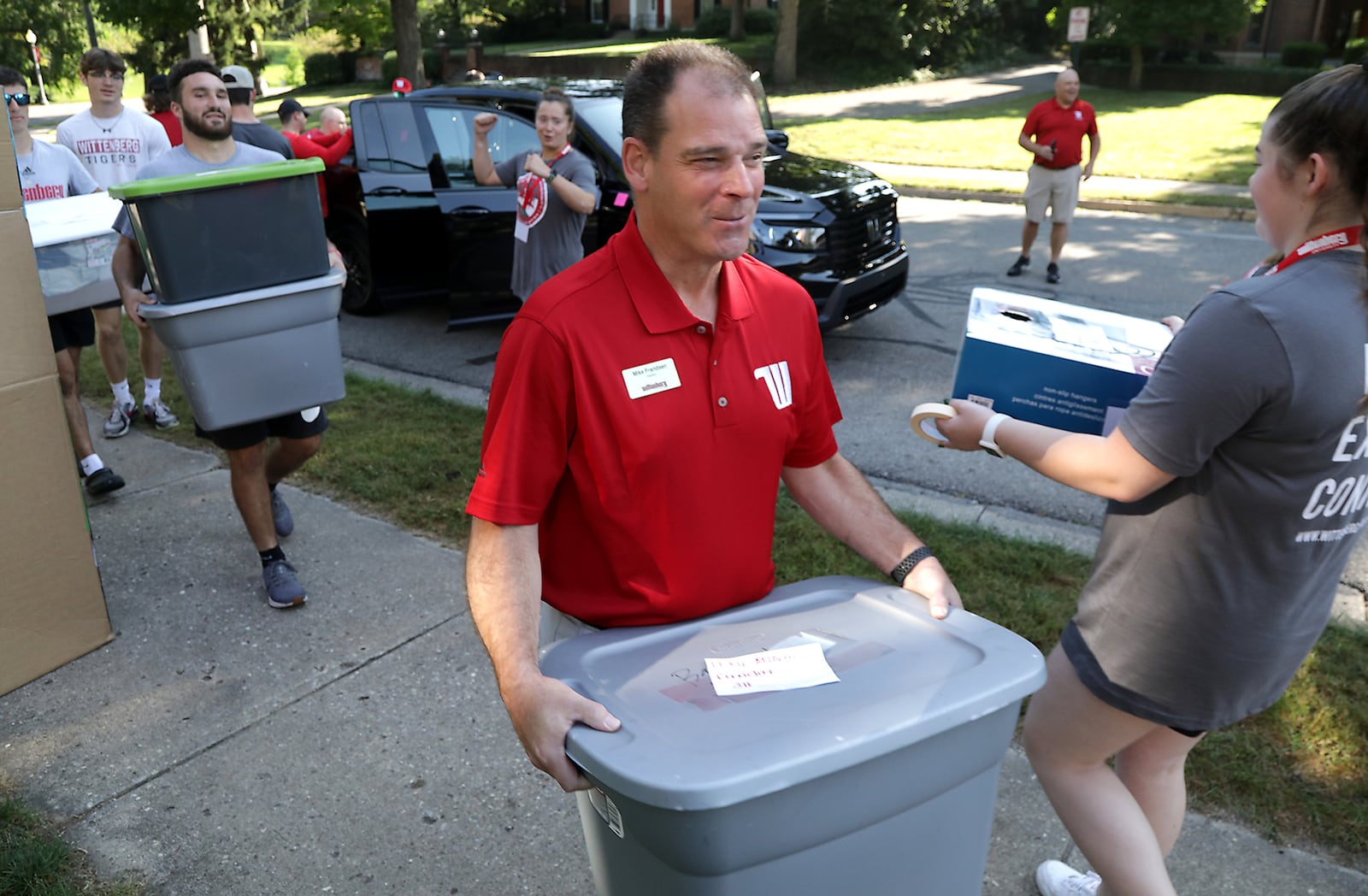 Wittenbeg University President Mike Frandsen helps a student carry their things into the dorm Thursday, August 25, 2022 during Move-In day. Wittenberg's fall semester starts Monday, August 29. BILL LACKEY/STAFF