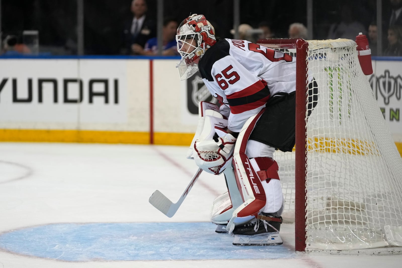 New Jersey Devils goalie Isaac Poulter stands on the ice during the second period of an NHL preseason hockey game against the New York Rangers, Tuesday, Oct. 1, 2024, in New York. (AP Photo/Pamela Smith)