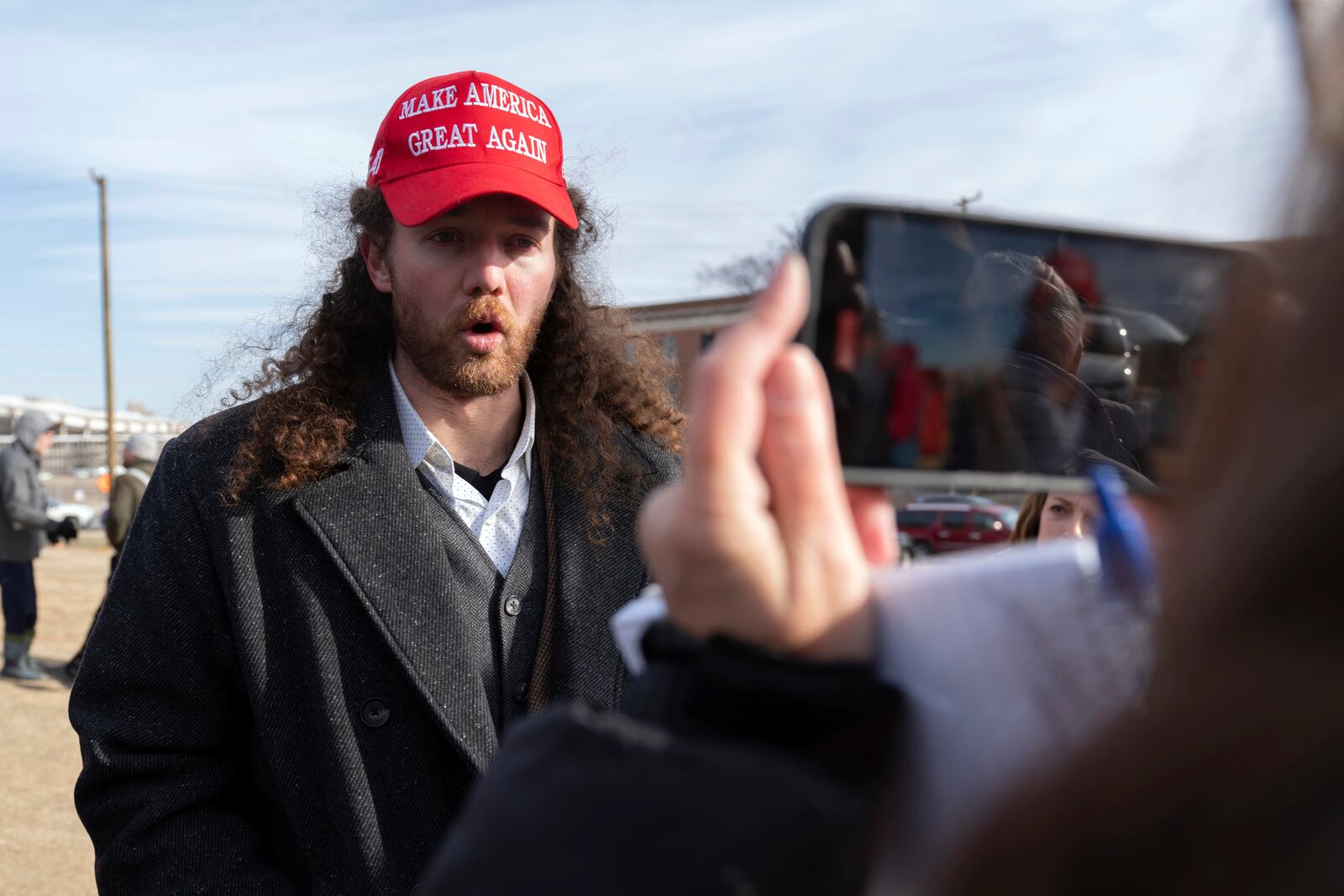 President Donald Trump supporter Robert Morss, who participated in the Jan. 6 riots in the U.S. Capitol, speaks to reporters after being released early morning from Pittsburgh Loretto prison and is outside of DC Central Detention Facility in solidarity for the other people there, Tuesday, Jan. 21, 2025, in Washington. Morse was release after 3 and a half years in prison. (AP Photo/Jose Luis Magana)