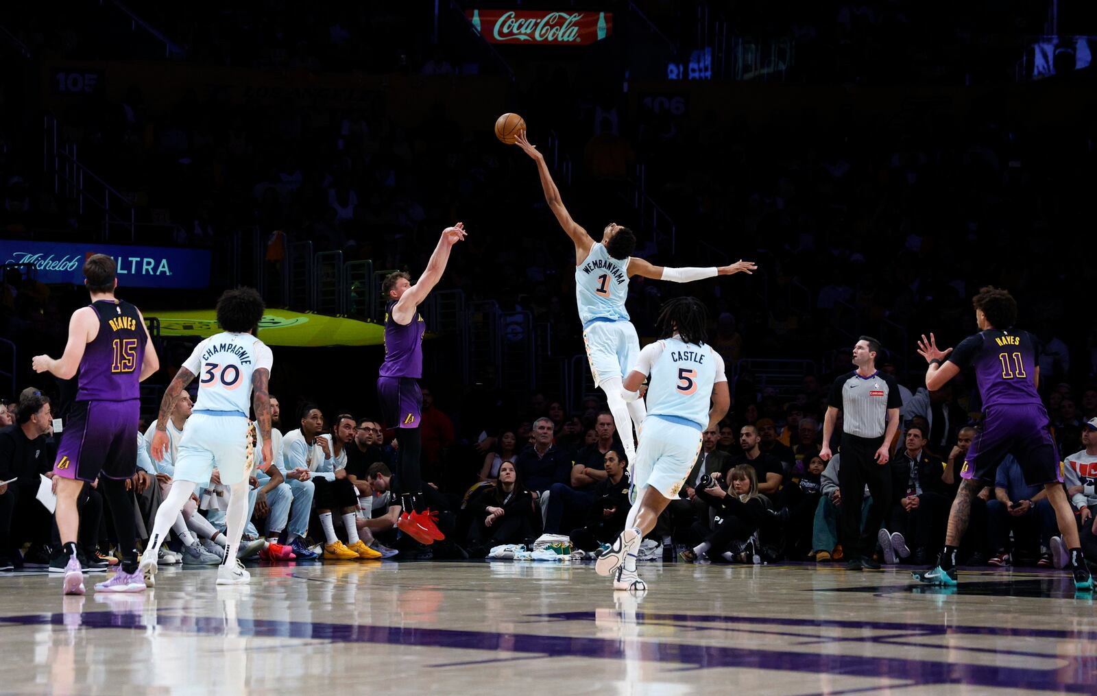 San Antonio Spurs center Victor Wembanyama (1) blocks a 3-point basket-attempt by Los Angeles Lakers guard Dalton Knecht, third from front left, during the first quarter of an NBA basketball game Monday, Jan. 13, 2025, in Los Angeles. (AP Photo/Kevork Djansezian)