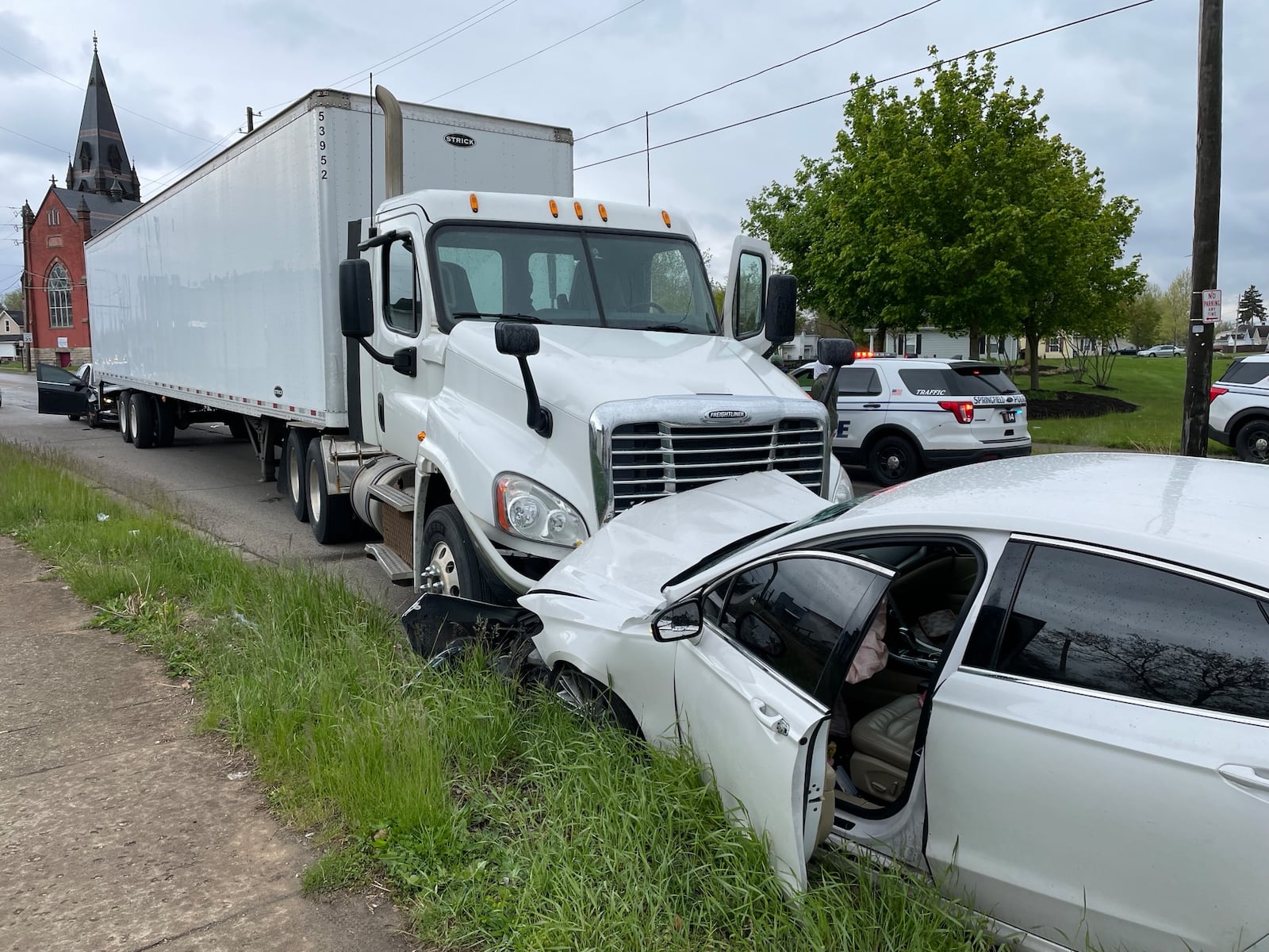 The driver of a Ford Fusion got out and ran after crashing head-on into a semi truck on Selma Road Tuesday, May 2, 2023. A second car wasn’t able to stop and crashed into the rear of the truck’s trailer. A female was transported from the scene by medic unit. BILL LACKEY/STAFF