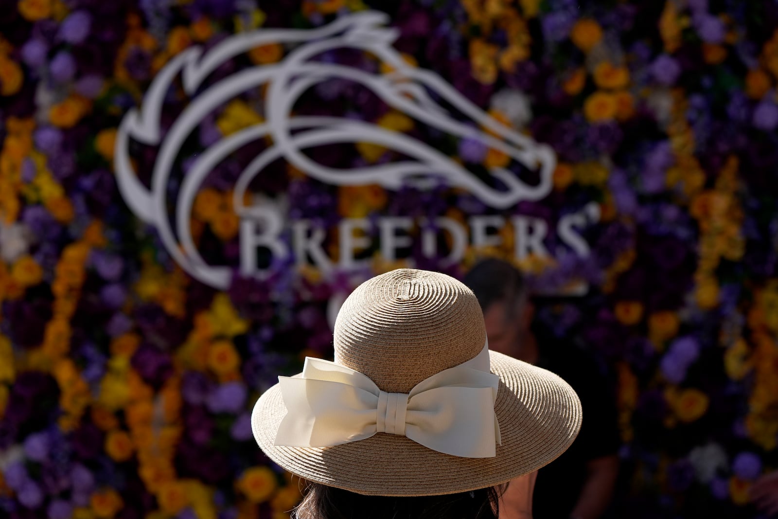 A woman is shown at Santa Anita Park for Breeders' Cup horse racing in Del Mar, Calif., Friday, Nov. 1, 2024. (AP Photo/Gregory Bull)