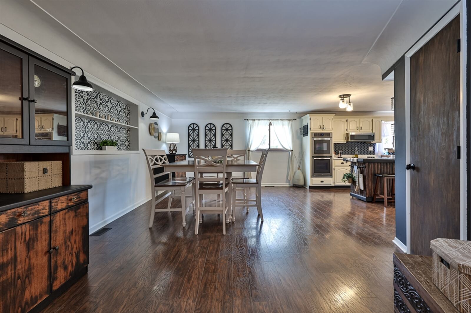 Off the foyer to the left, the floor plan was opened into a spacious kitchen and flexible space room with dining area.