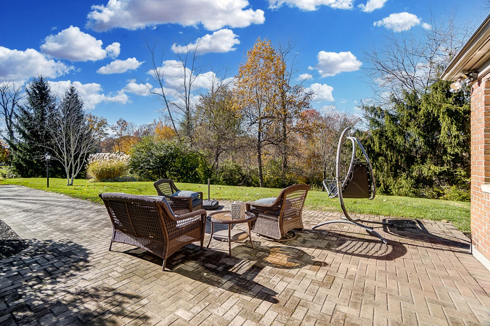 A 4-season room leads to a paver patio area with retractable awning. The patio area overlooks the mostly wooded back yard. CONTRIBUTED PHOTO