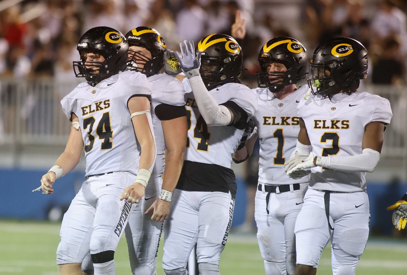 Centerville players, including Lucas Mullinger (34), react after a defensive stop against Fairmont on Friday, Sept. 13, 2024, at Roush Stadium. David Jablonski/Staff