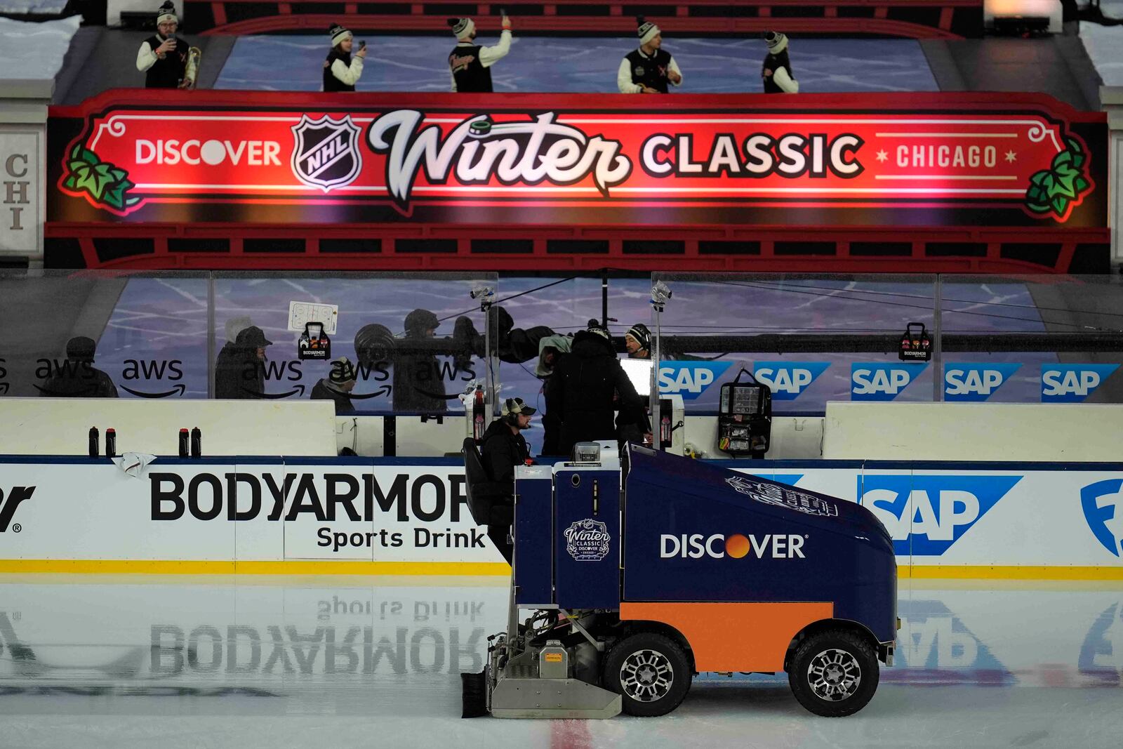 The zamboni clears the ice before the NHL Winter Classic outdoor hockey game featuring the Chicago Blackhawks and St. Louis Blues at Wrigley Field, Tuesday, Dec. 31, 2024, in Chicago. (AP Photo/Erin Hooley)