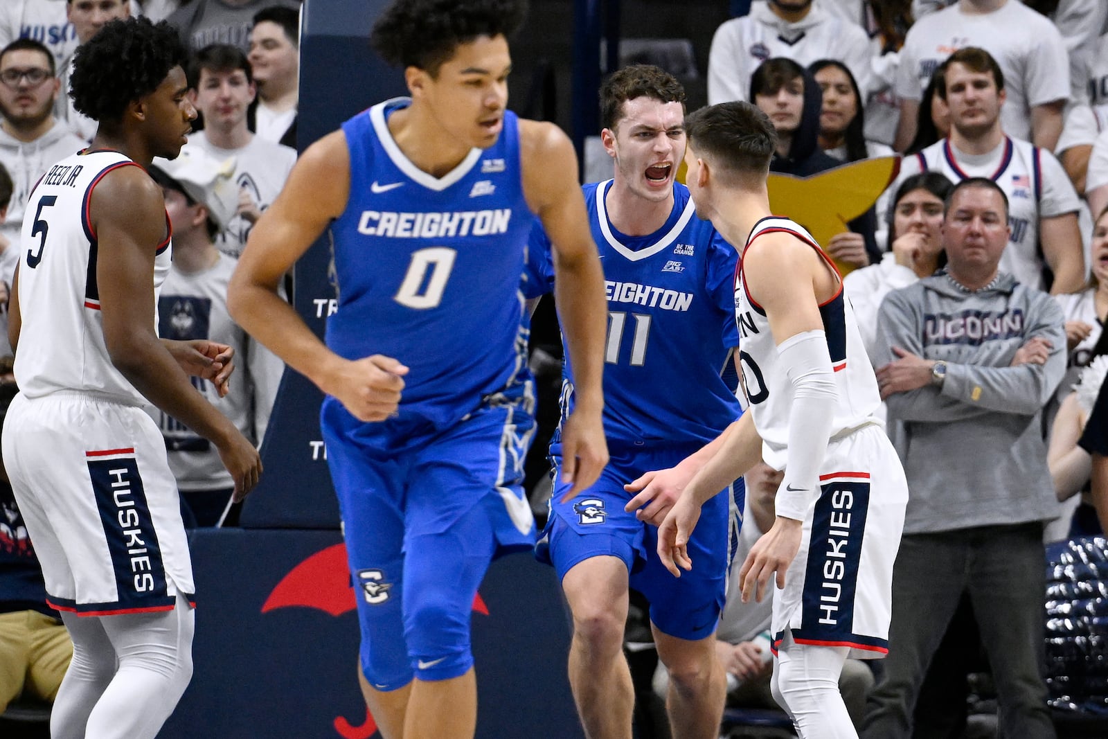 Creighton center Ryan Kalkbrenner (11) reacts toward UConn guard Aidan Mahaney after making a basket in the second half of an NCAA college basketball game, Saturday, Jan. 18, 2025, in Storrs, Conn. (AP Photo/Jessica Hill)