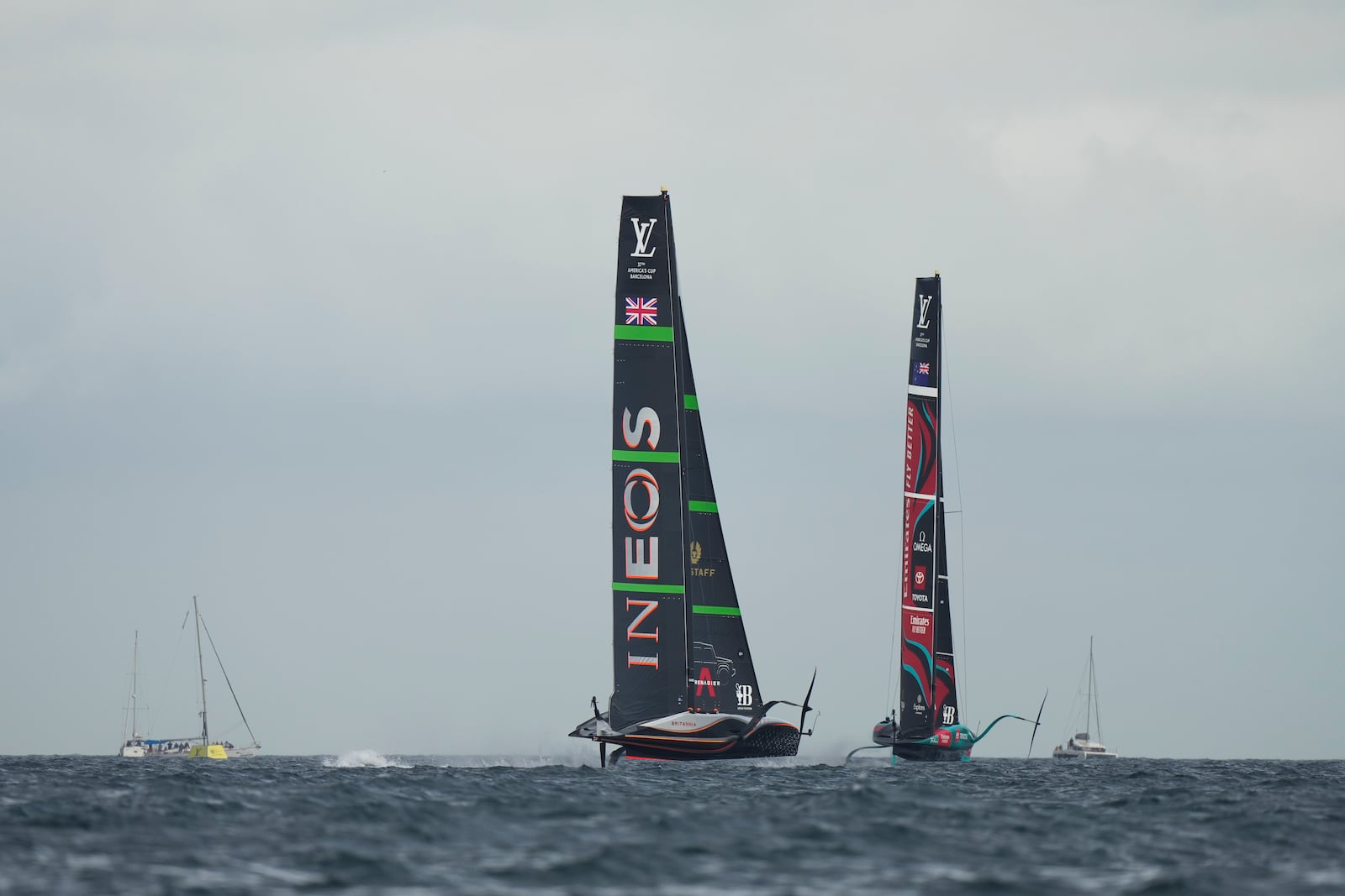 Ineos Britannia and Emirates Team New Zealand race during the Louis Vuitton 37th America's Cup race in Barcelona, Spain, Saturday, Oct. 12, 2024. (AP Photo/Bernat Armangue)