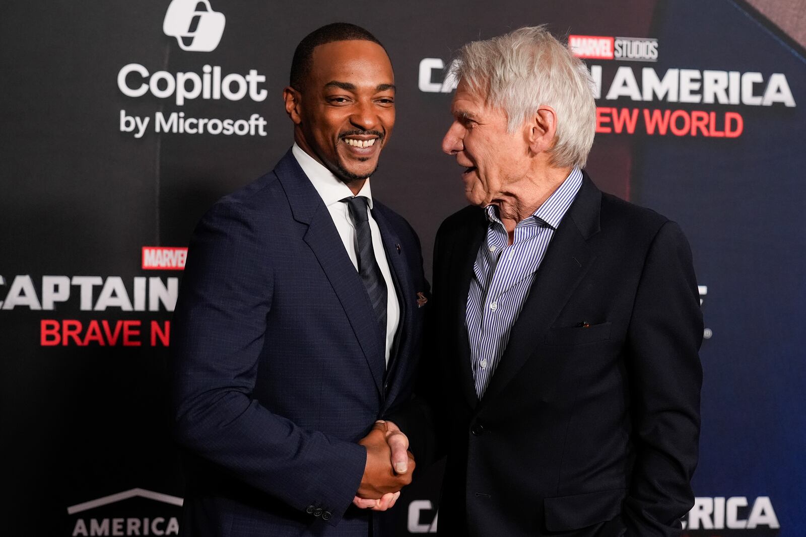 Anthony Mackie, left, and Harrison Ford arrive at the premiere of "Captain America: Brave New World" on Tuesday, Feb. 11, 2025, at the TCL Chinese Theatre in Los Angeles. (AP Photo/Chris Pizzello)