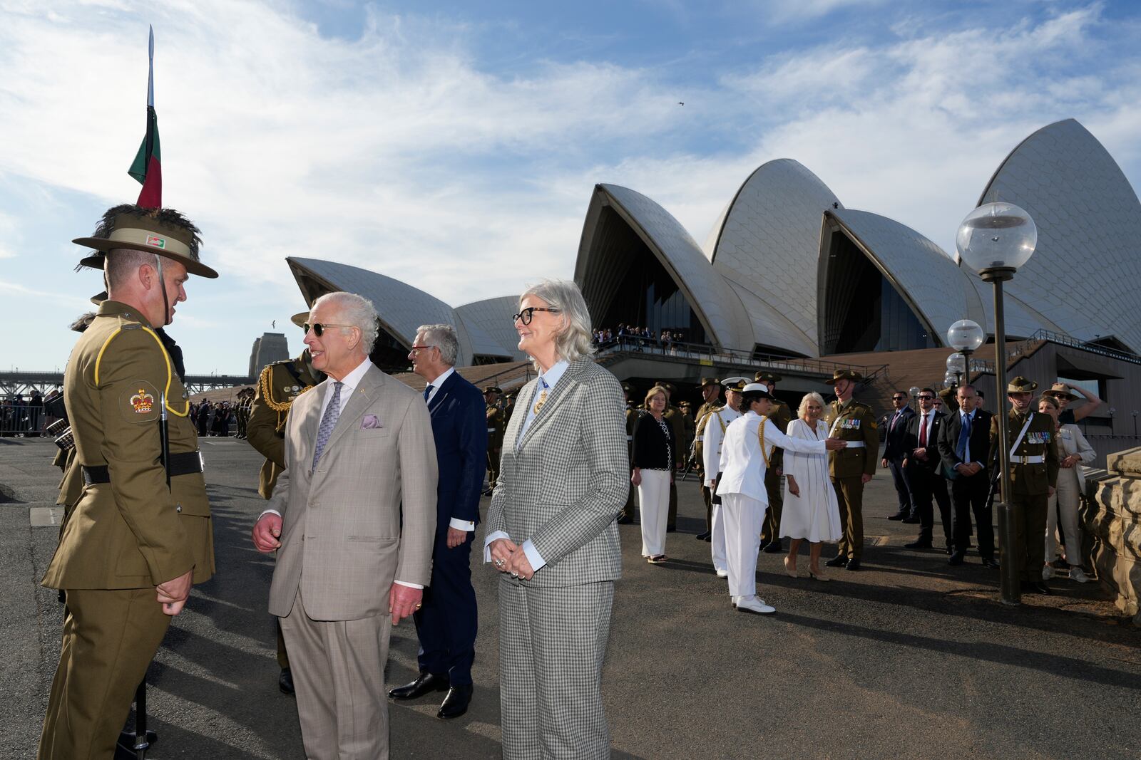 Britain's King Charles III, second from left, talks to an honor guard beside Australia's Governor-General Sam Mostyn during his visit to Sydney Opera House in Sydney, Australia, Tuesday, Oct. 22, 2024. (AP Photo/Mark Baker, Pool)