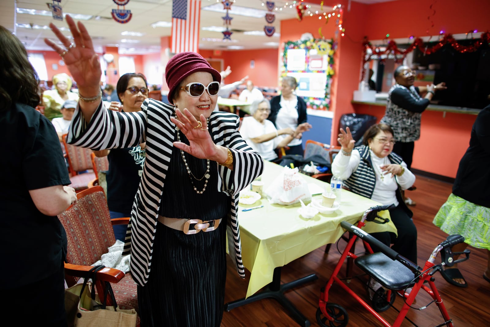 People attend a Zumba exercise class at Sunshine Adult Day Center in Bergenfield, N.J., Monday, Aug. 26, 2024. (AP Photo/Kena Betancur)