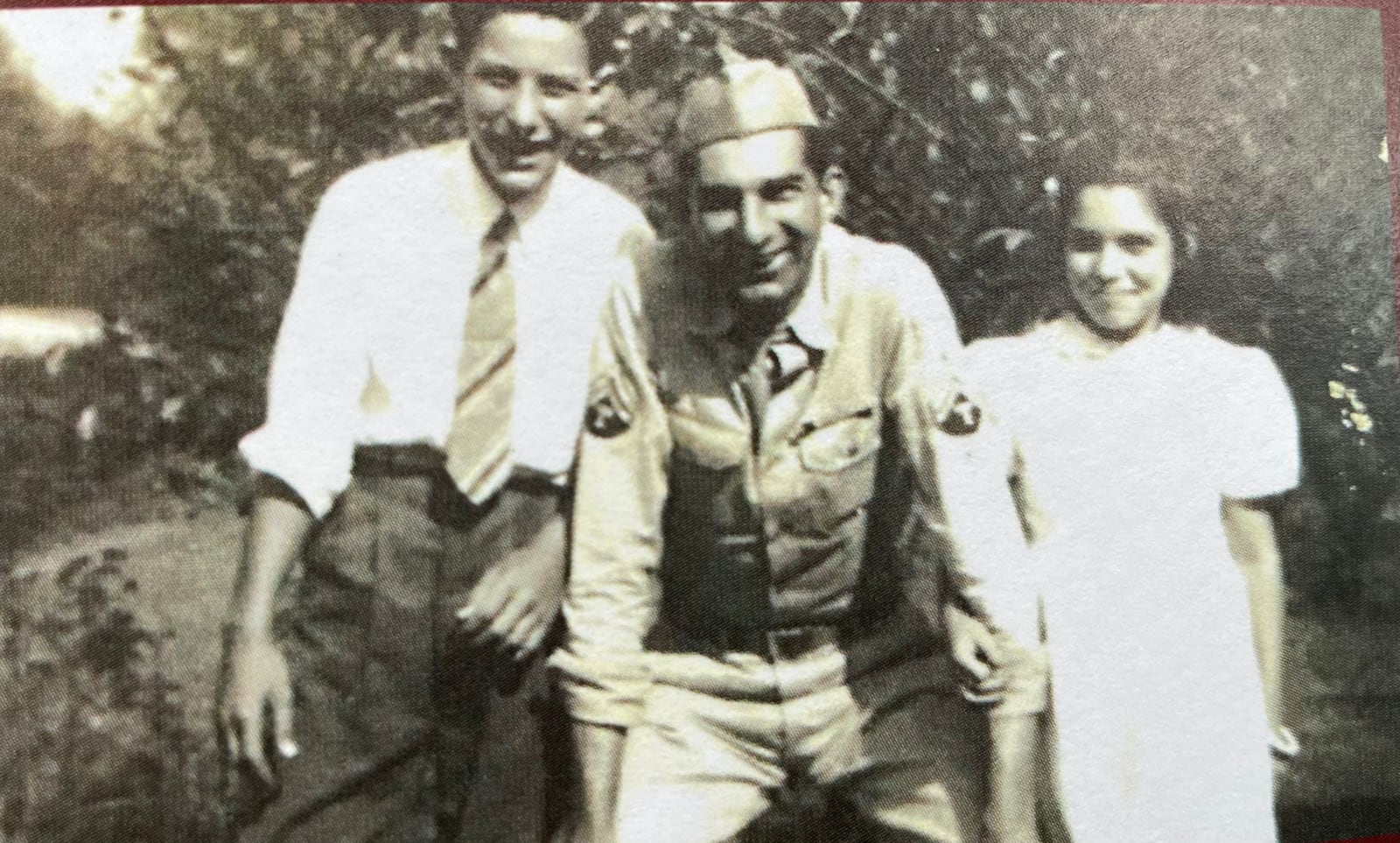 A smiling Charles Hiltibran stand with his family. Photo provided.