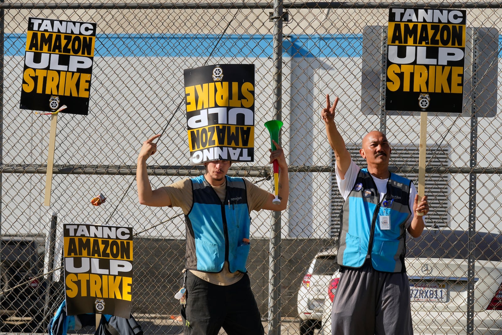 Amazon workers strike outside the gates of an Amazon Fulfillment Center as Teamsters seek labor contract nationwide Friday, Dec. 20, 2024, in City of Industry, Calif. (AP Photo/Damian Dovarganes)