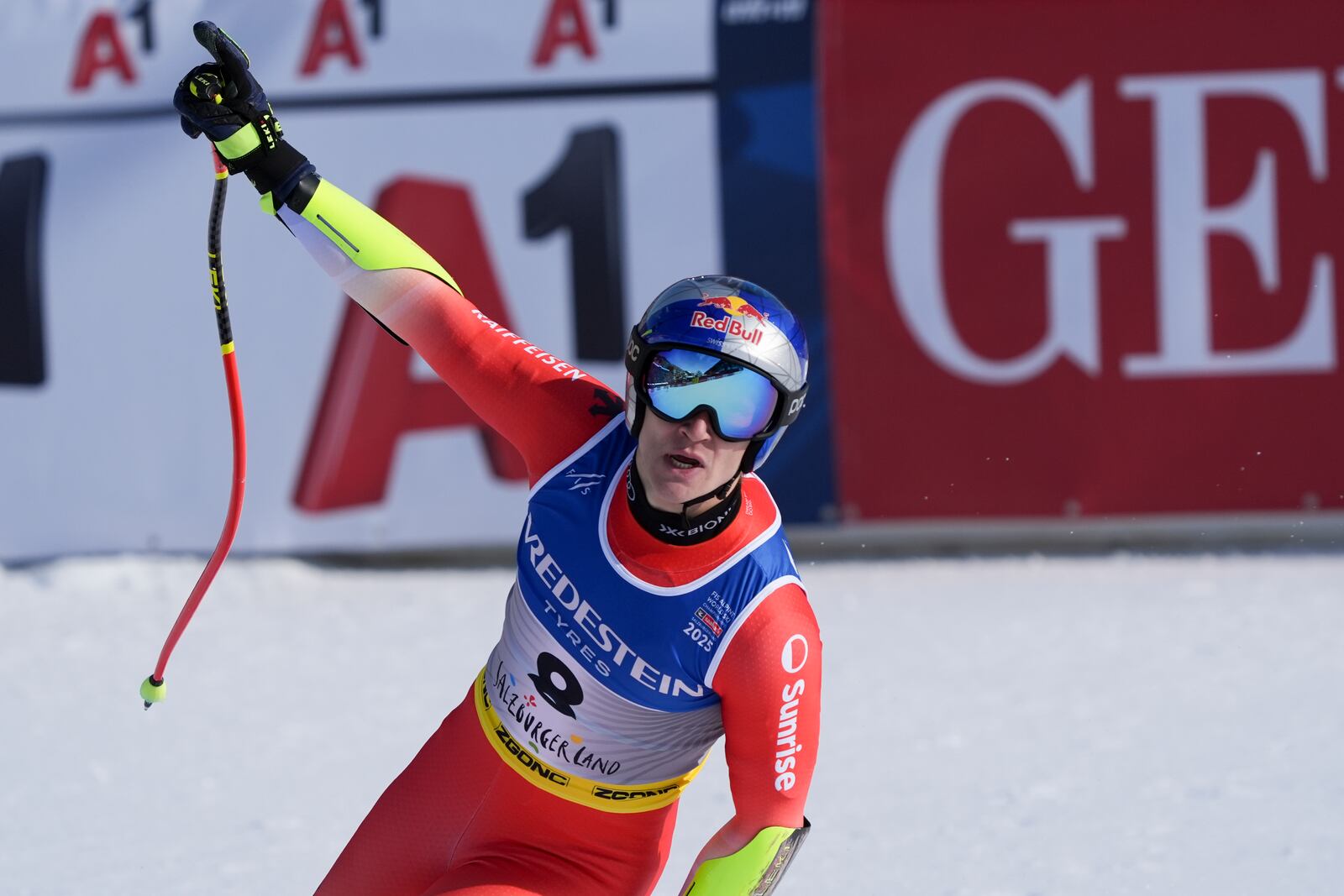 Switzerland's Marco Odermatt celebrates at the finish area of a men's Super-G, at the Alpine Ski World Championships, in Saalbach-Hinterglemm, Austria, Friday, Feb. 7, 2025. (AP Photo/Giovanni Auletta)