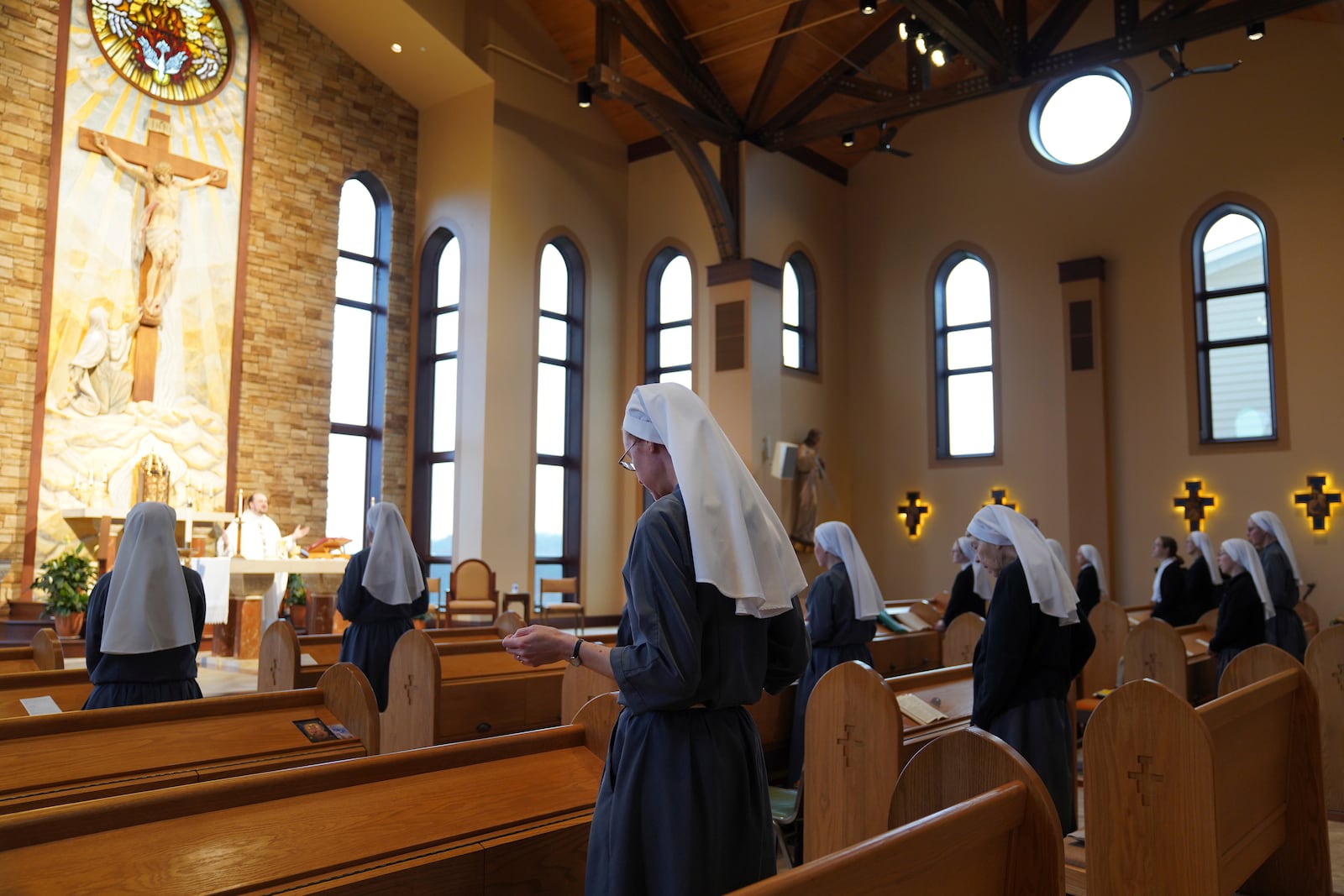 The Franciscan Sisters, T.O.R. of Penance of the Sorrowful Mother stand during Mass in Toronto, Ohio, Thursday, Nov. 7, 2024. (AP Photo/Jessie Wardarski)